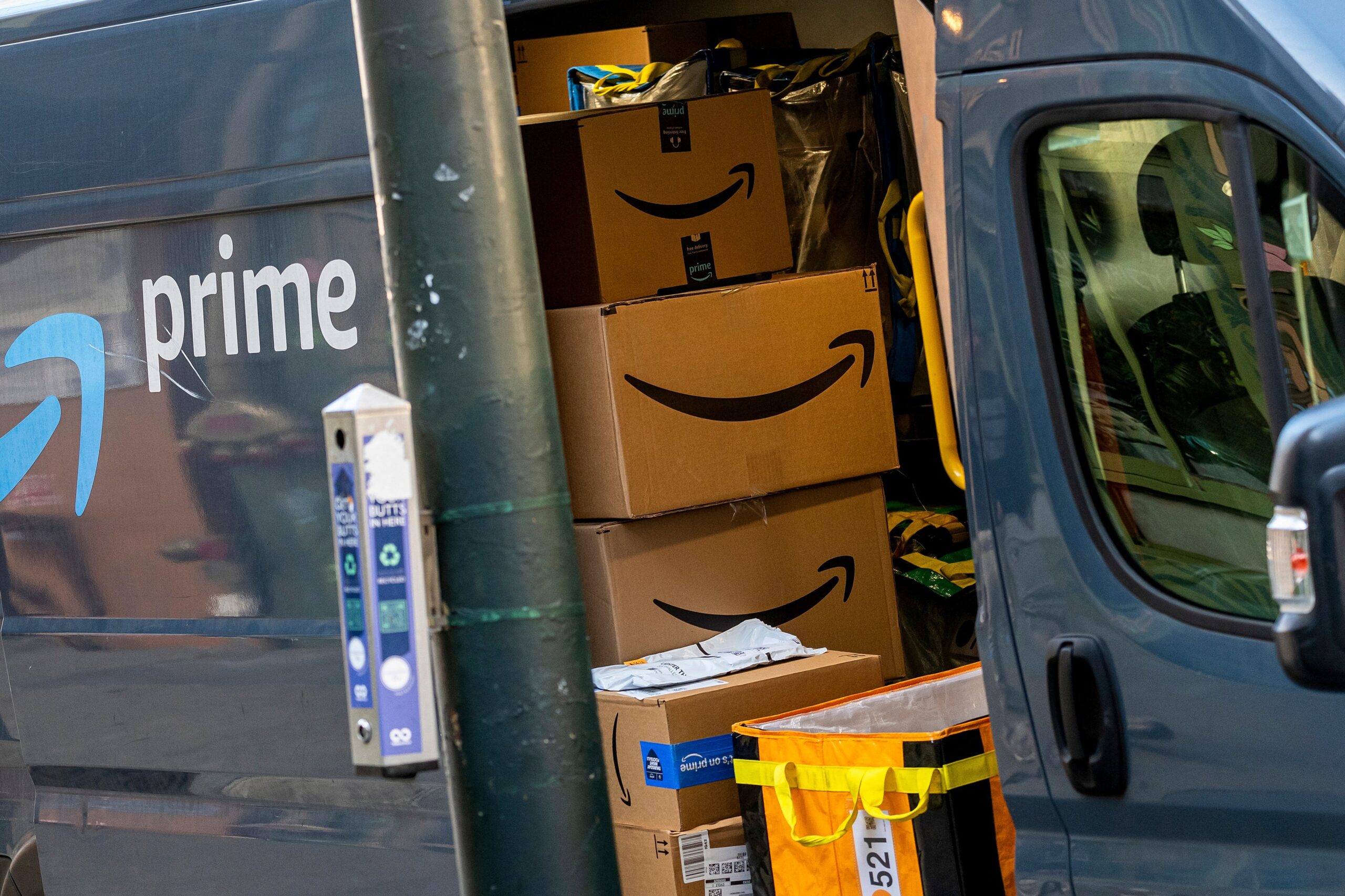 A view inside of an Amazon delivery truck filled with boxes.