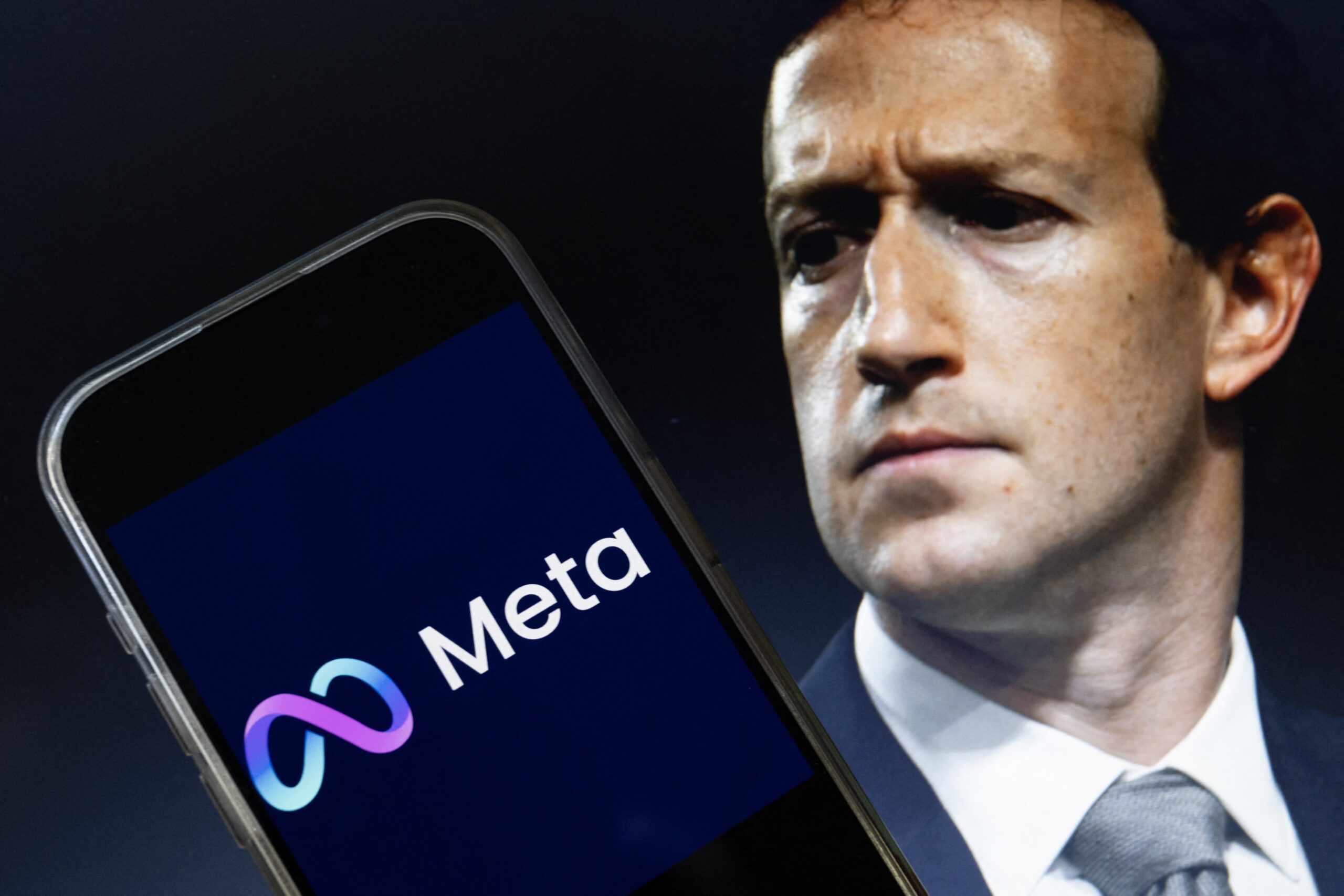 This photo illustration created on January 7, 2025, in Washington, DC, shows an image of Mark Zuckerberg, CEO of Meta, and an image of the Meta logo. Social media giant Meta on January 7, 2025, slashed its content moderation policies, including ending its US fact-checking program, in a major shift that conforms with the priorities of incoming president Donald Trump. 