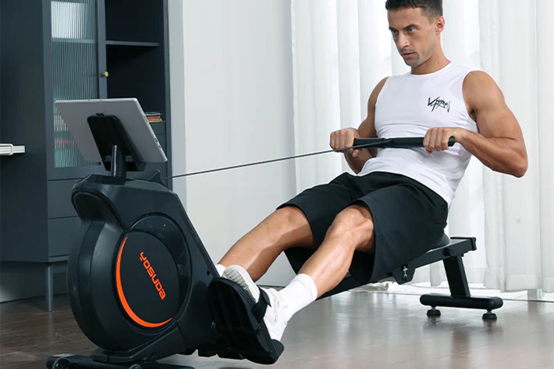 man using YOSUDA Rowing Machine 100