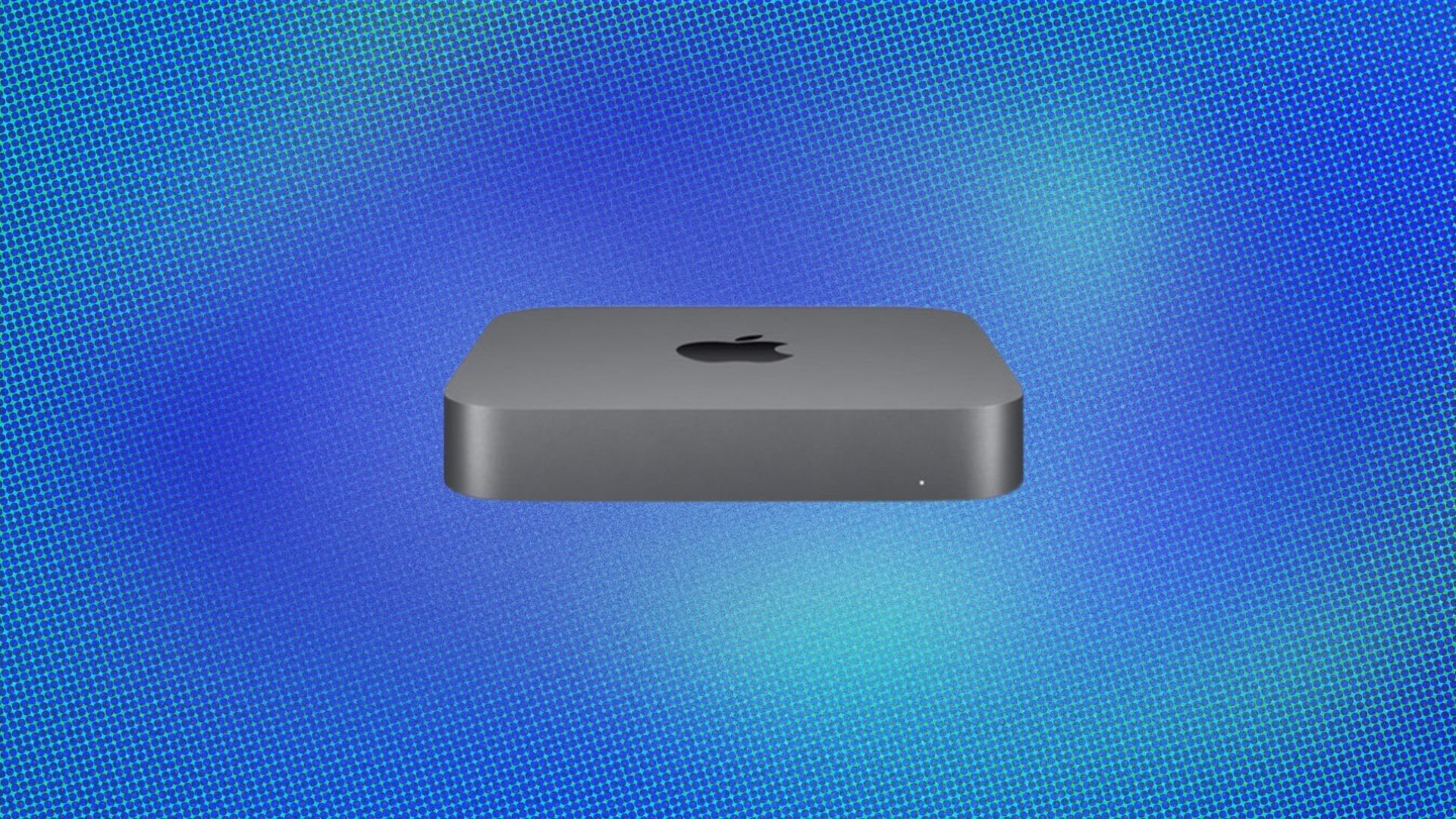 A gray Mac Mini showing the Apple logo on its top appears on a speckled blue halftone background.