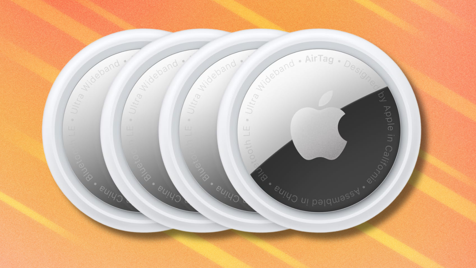 Apple AirTags on orange abstract background