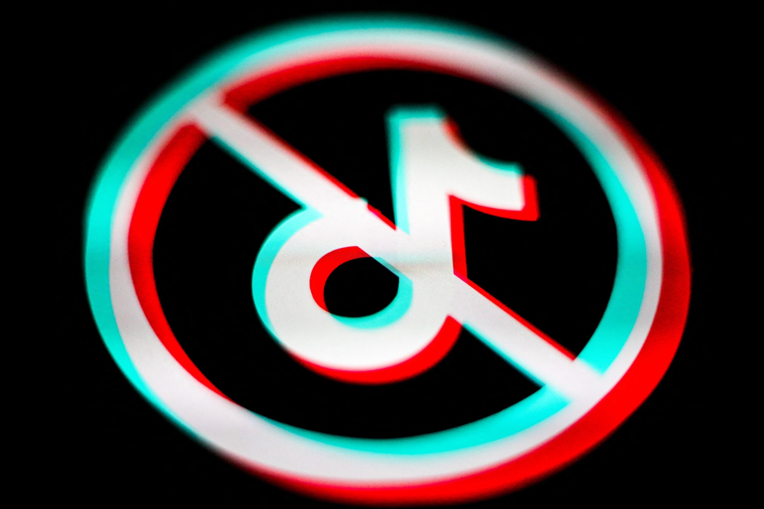 The TikTok logo within a circle and a line crossed through it.