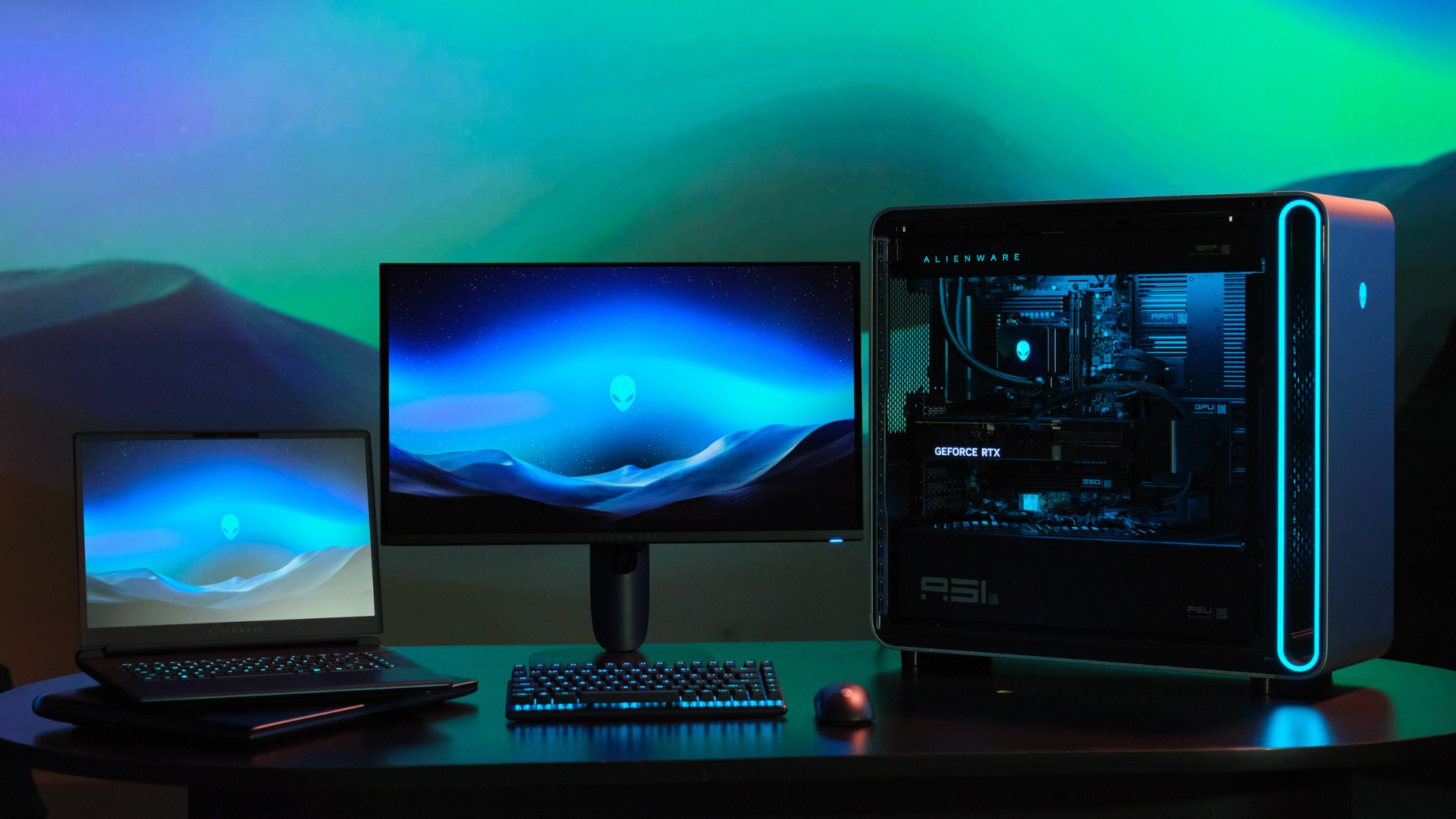 A photo of the Alienware monitor, Area-51 desktop, and Area-51 laptop