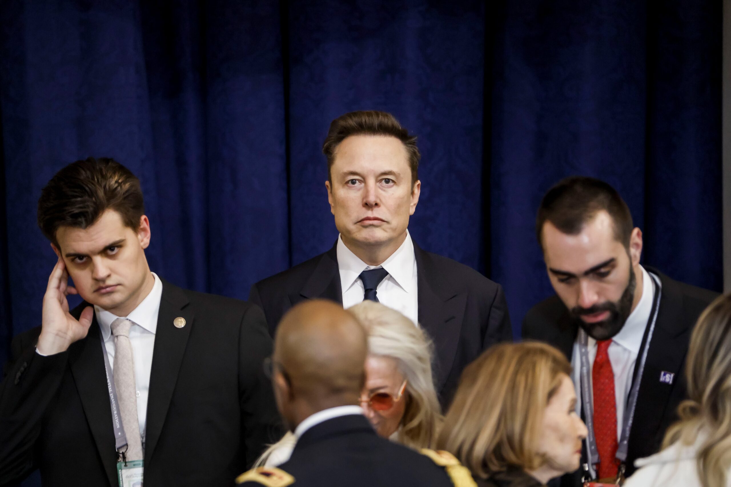 elon musk stares at camera at trump's inauguration