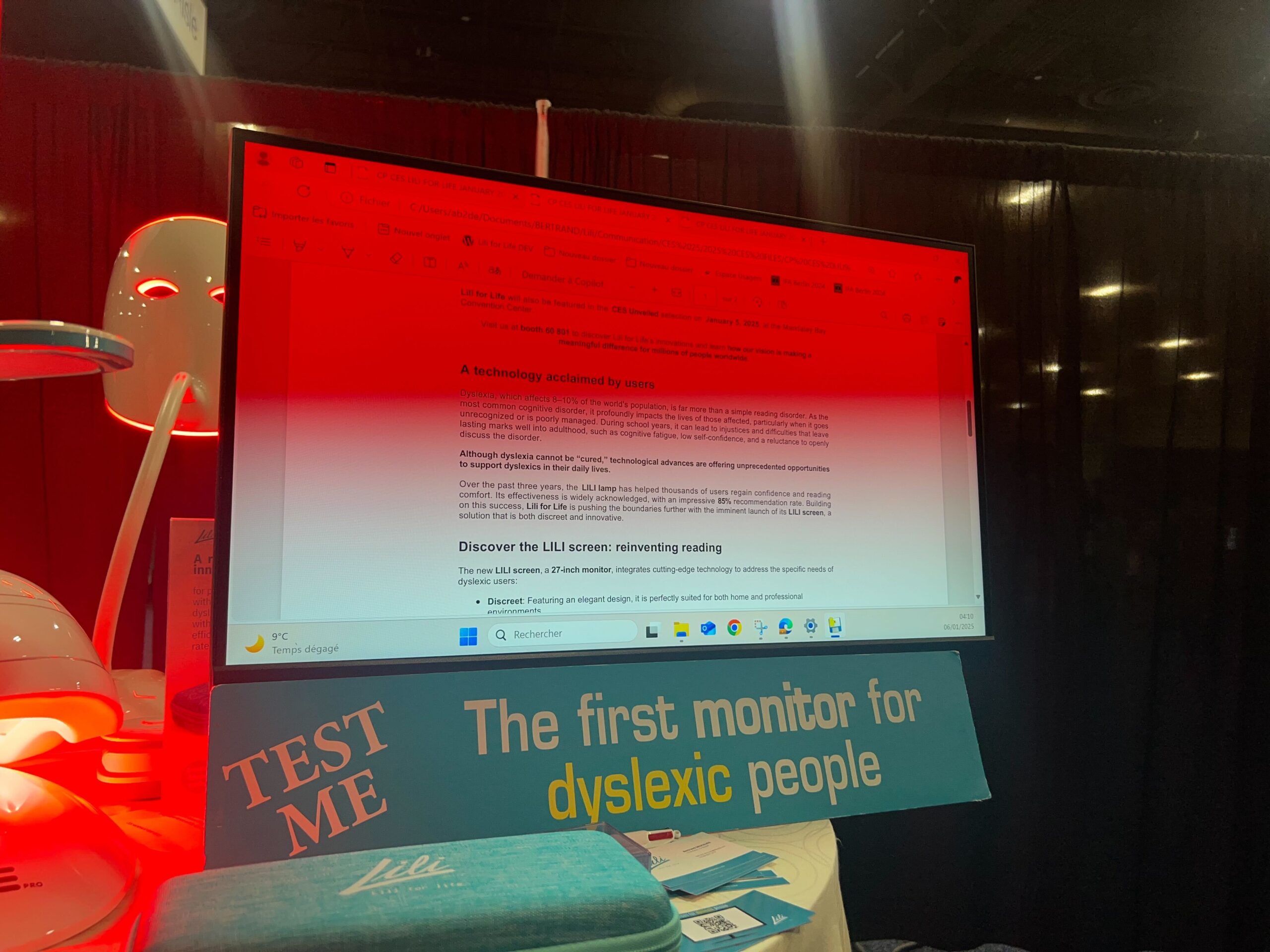 A bright shade of red illuminates part of a computer screen full of text. 