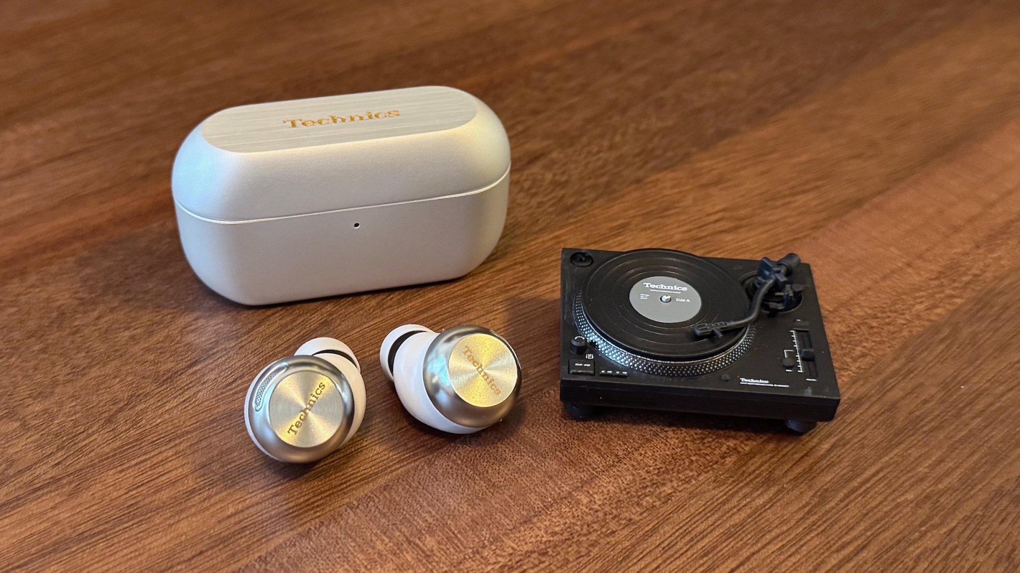 technics az100 wireless earbuds with charging case and miniature turntable