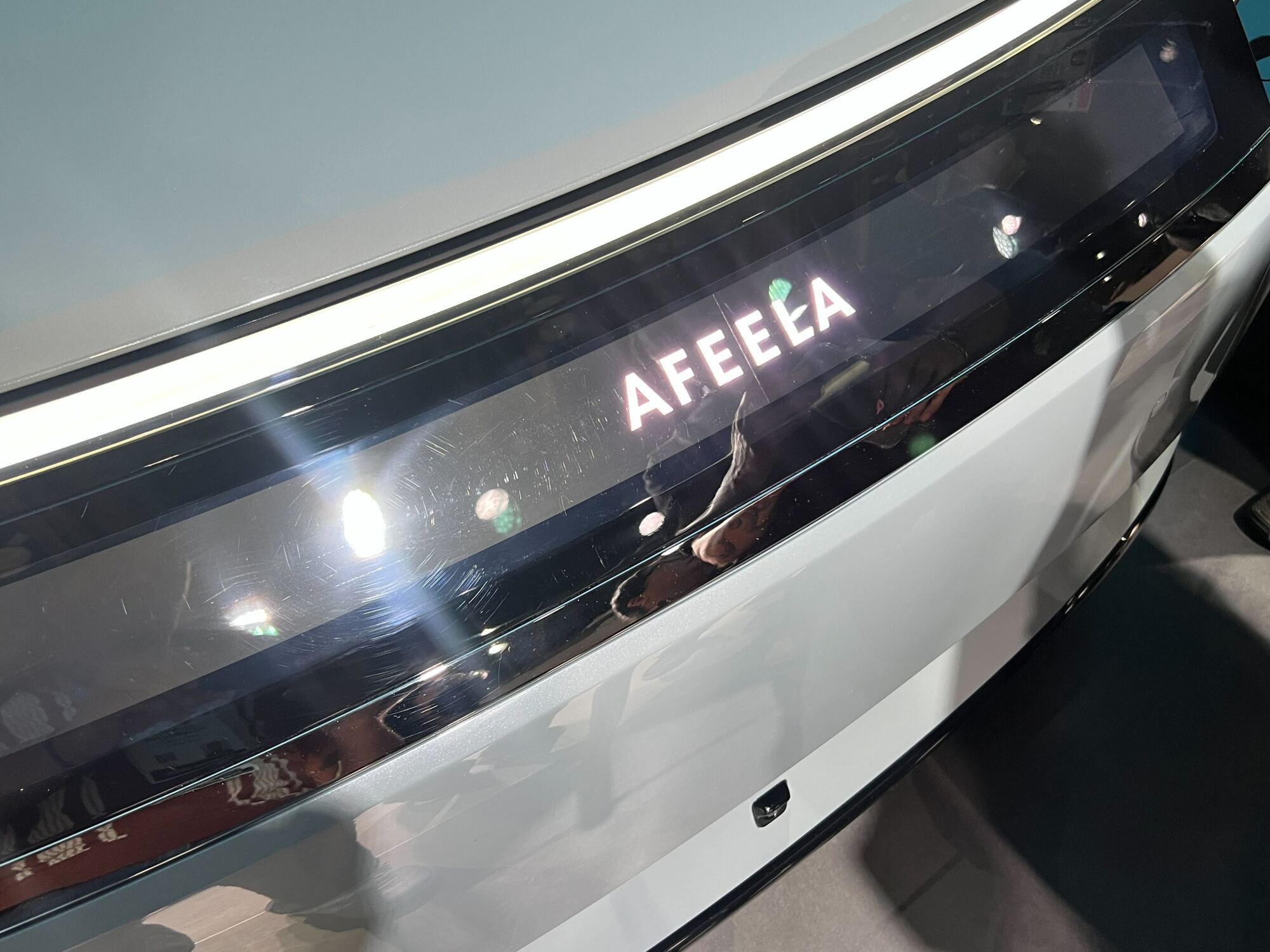 photo of a grey car with a display that reads "AFEELA"