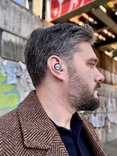 the author wearing the technics az100 wireless earbuds