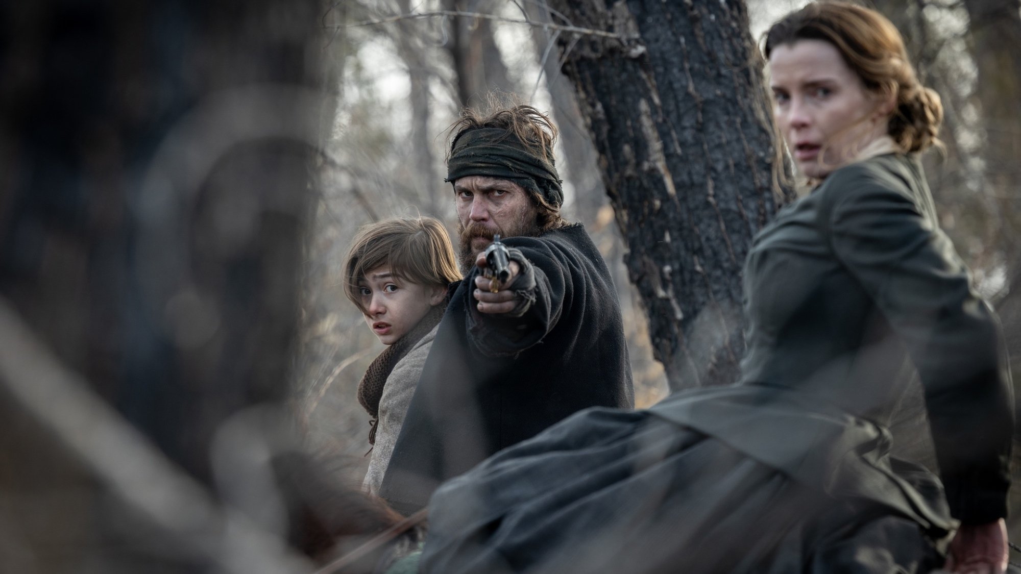 Preston Mota, Taylor Kitsch, and Betty Gilpin in "American Primeval."