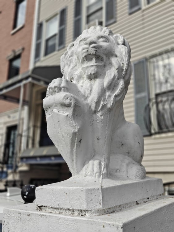 Portrait mode shot of a gargoyle in Brooklyn