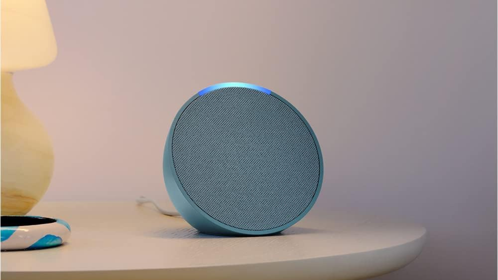 An Amazon Echo Pop on a table