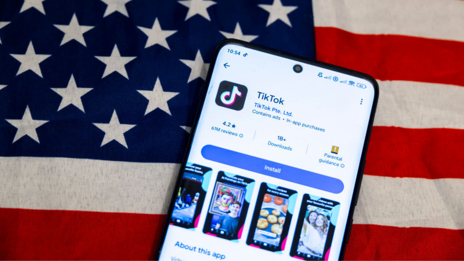 TikTok app logo on a smartphone screen displayed with the American flag.