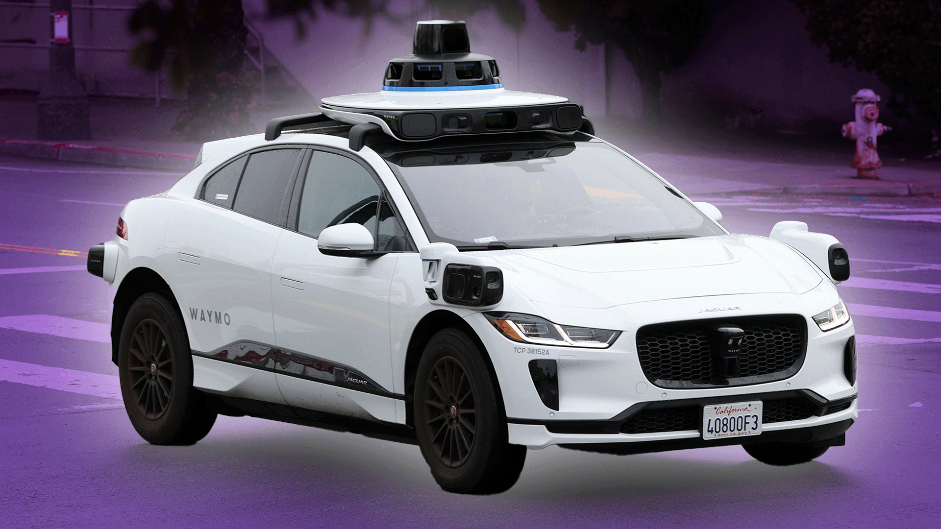 A Waymo car driving on the street. 