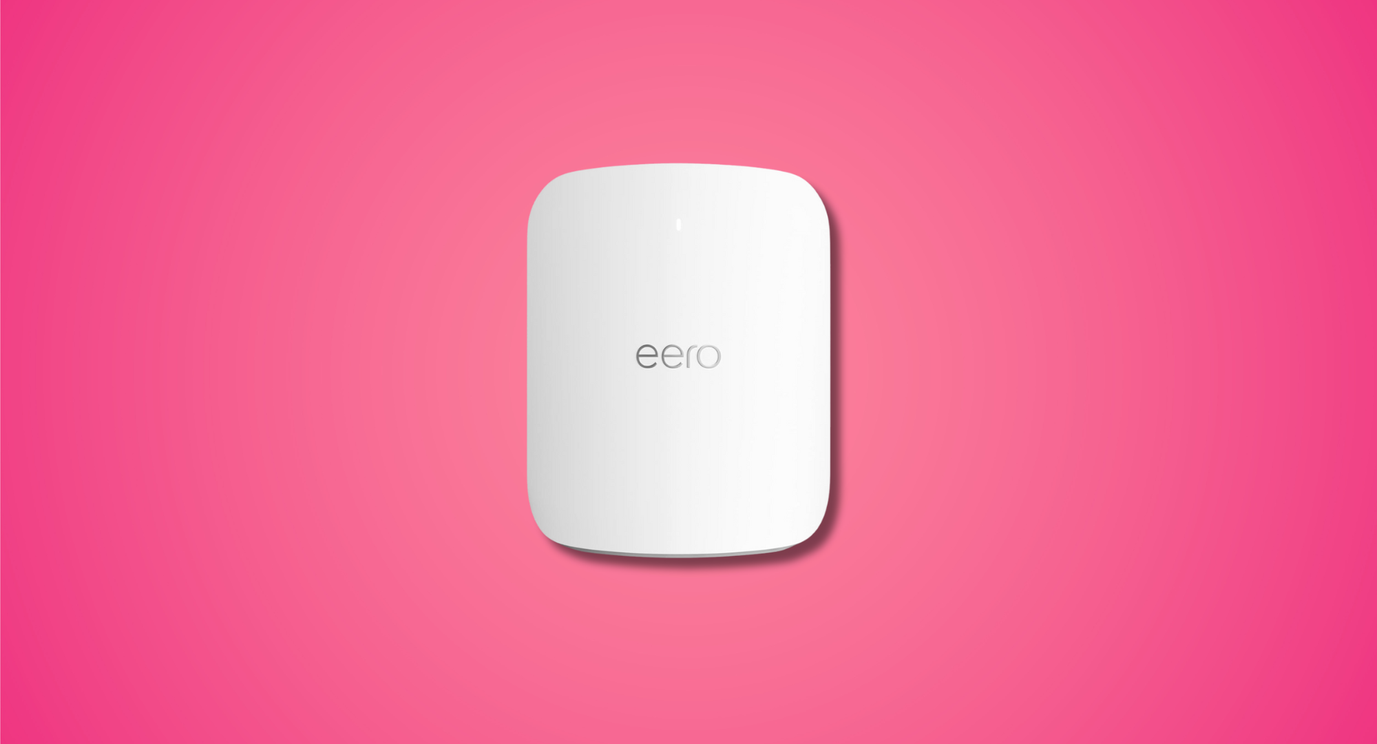 A white eero mesh WiFi router on a pink background.