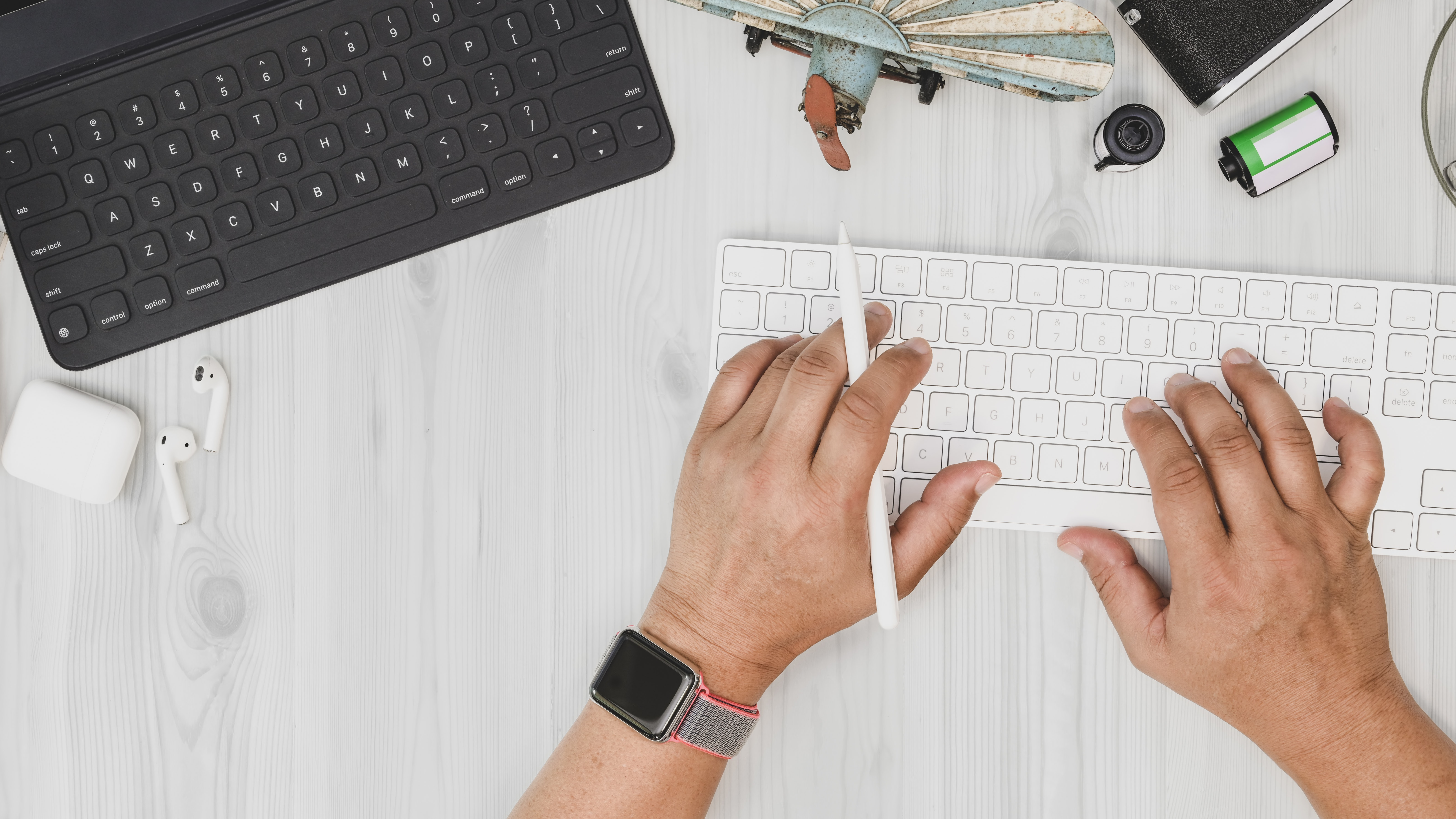 Hands typing on a keyboard