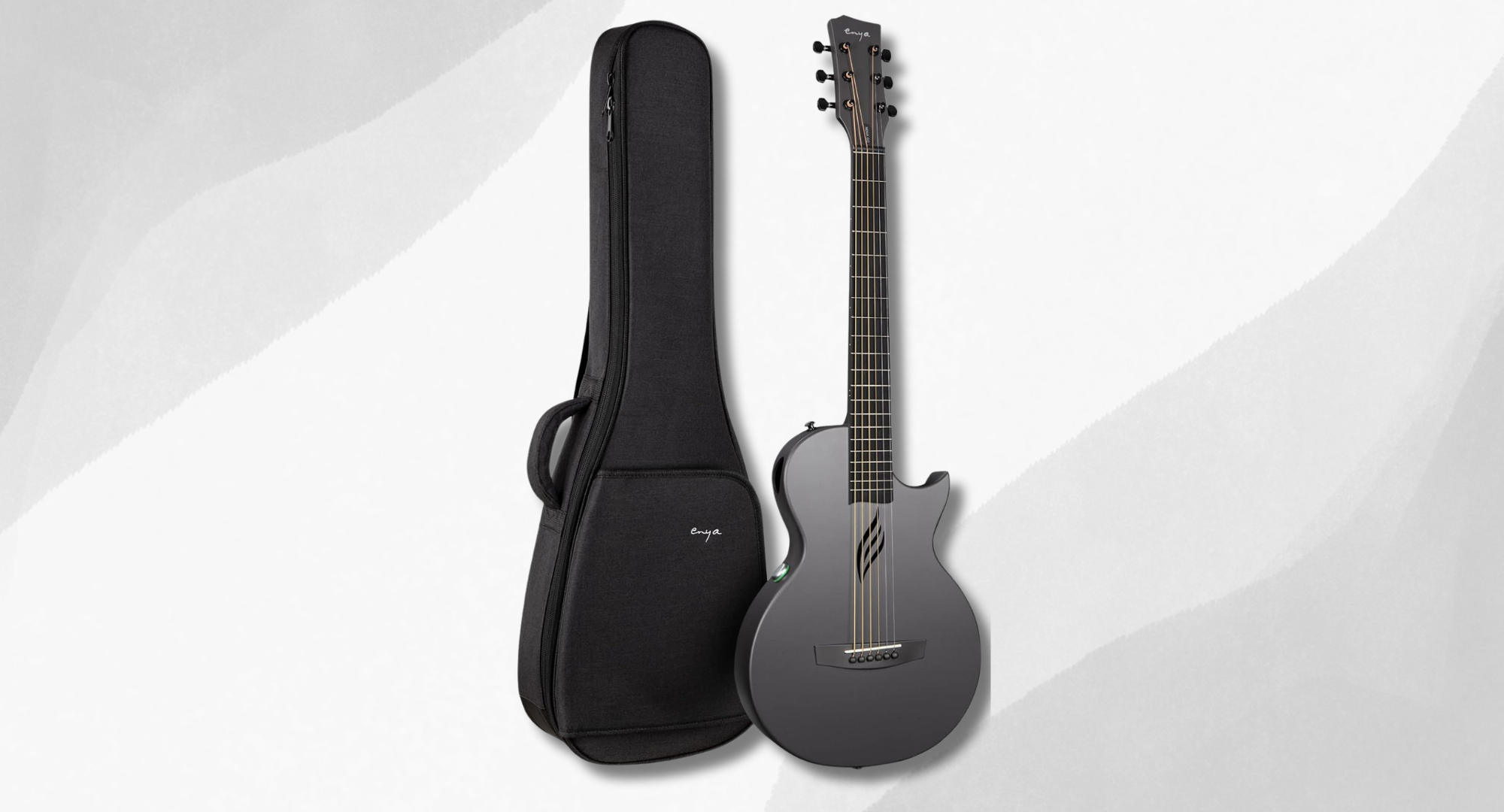 A gray Enya Nova Go SP1 guitar and its black gig bag on a light background.