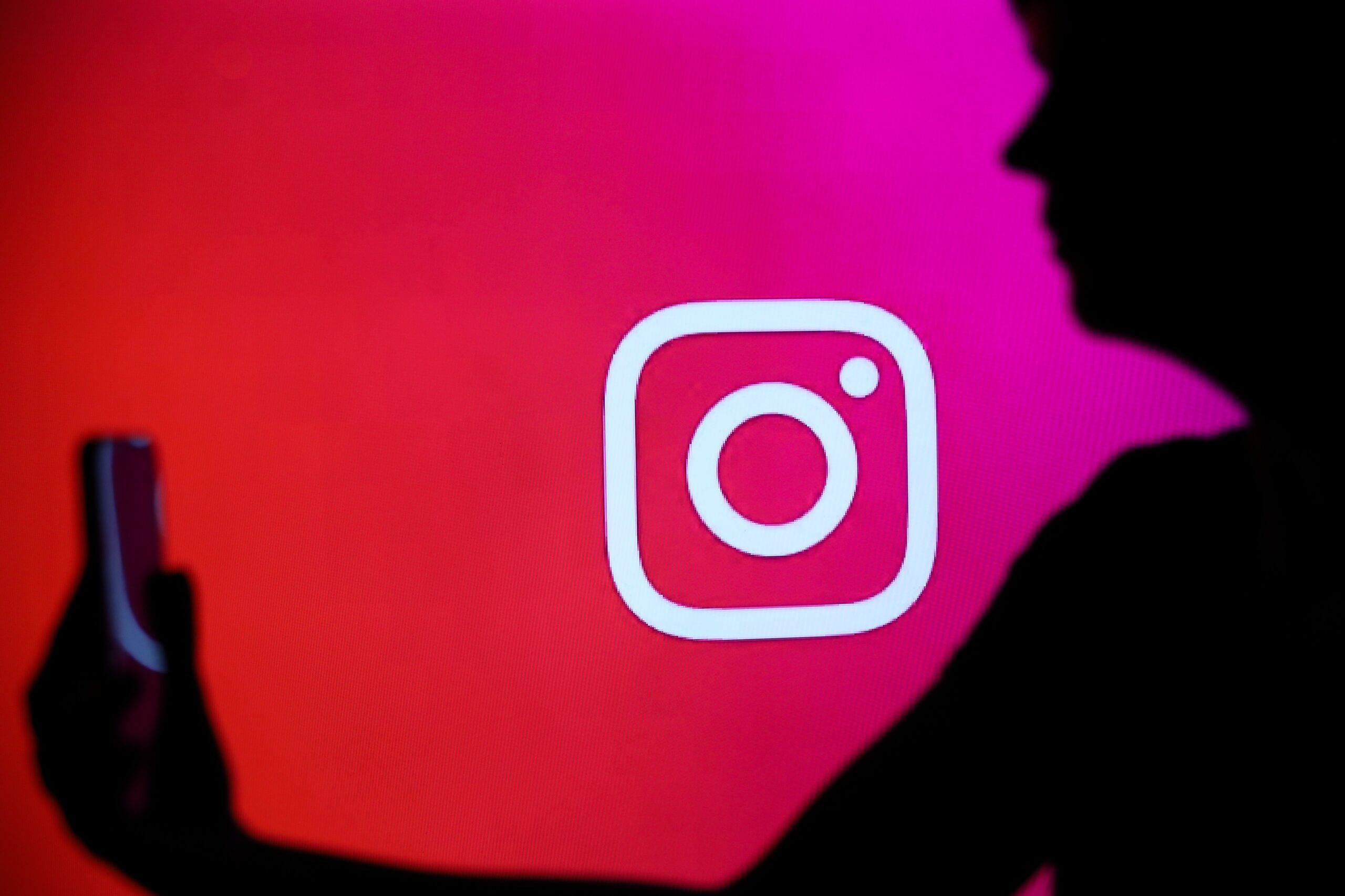 The Instagram logo with a person holding a phone in their hand is seen in Knurow, Poland, on December 26, 2024.