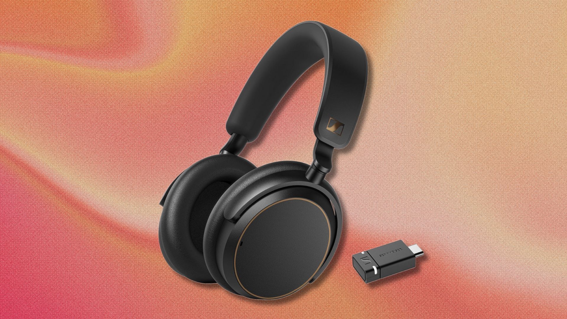 black sennheiser accentum headphones on a pink and orange swirling background