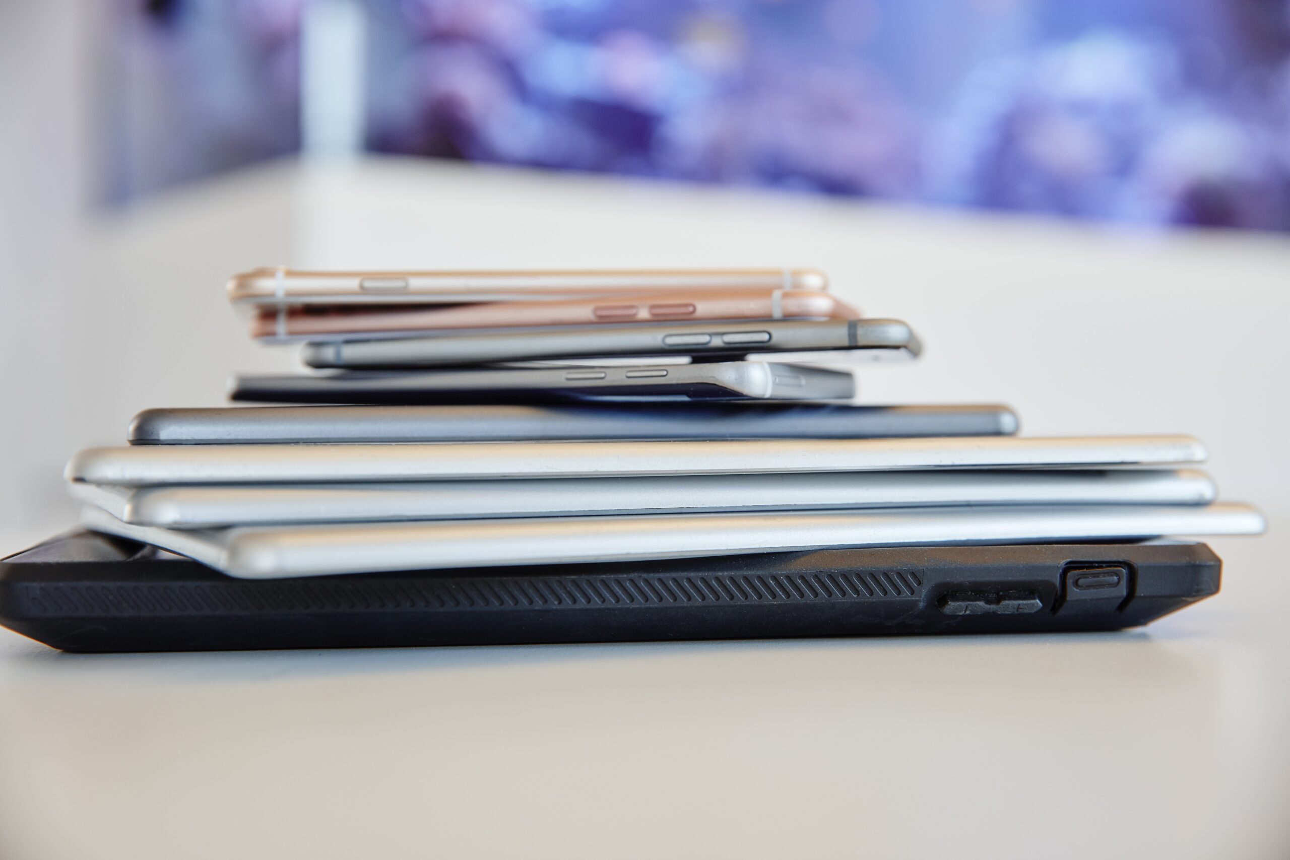 Stack of laptops and smartphones