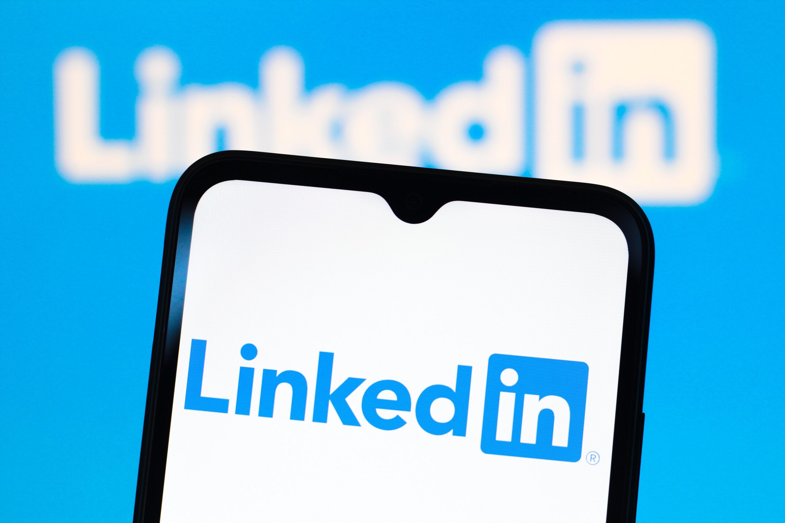  LinkedIn Corporation logo is seen displayed on a smartphone screen