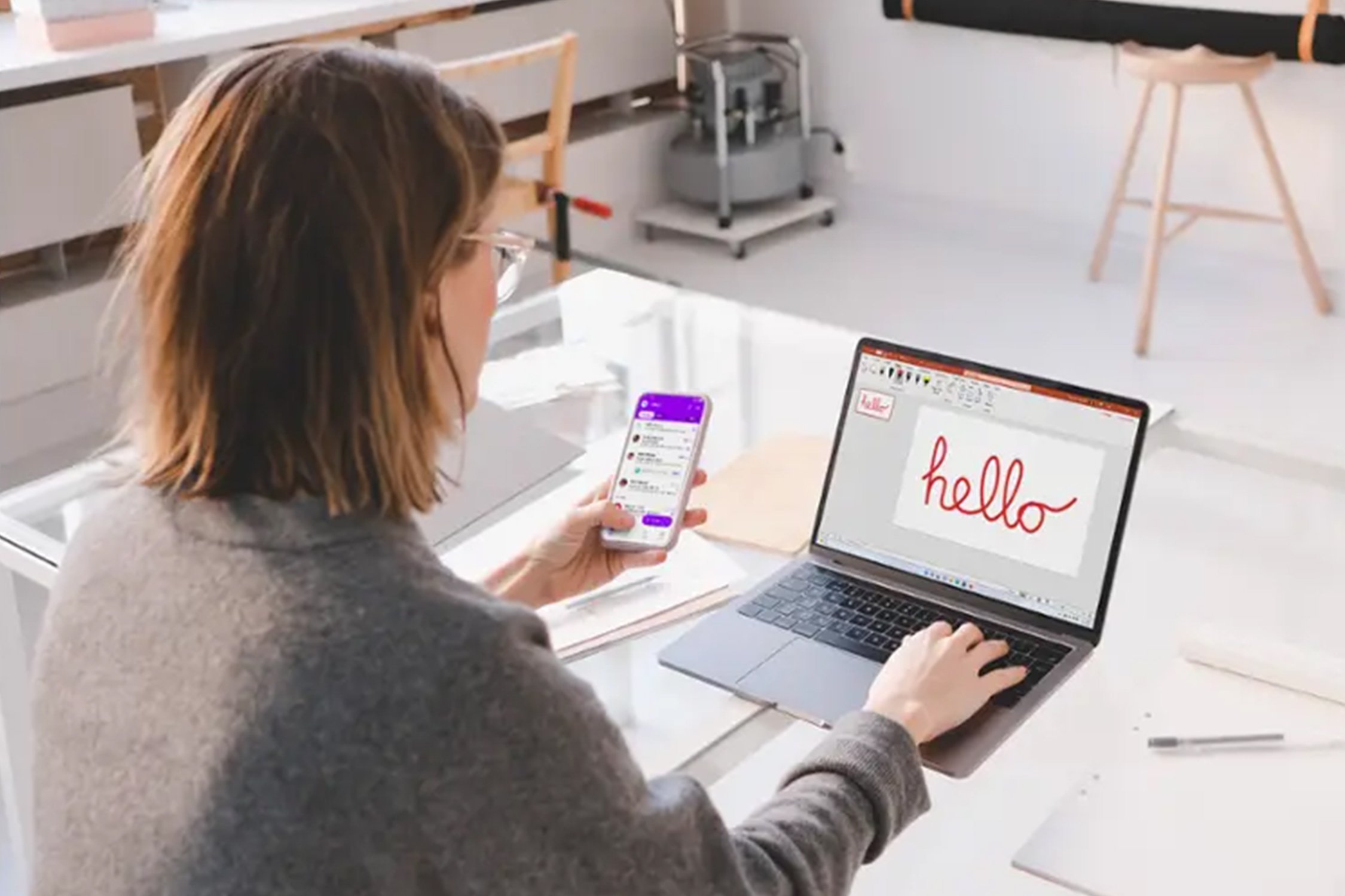 woman designing presentation on a laptop