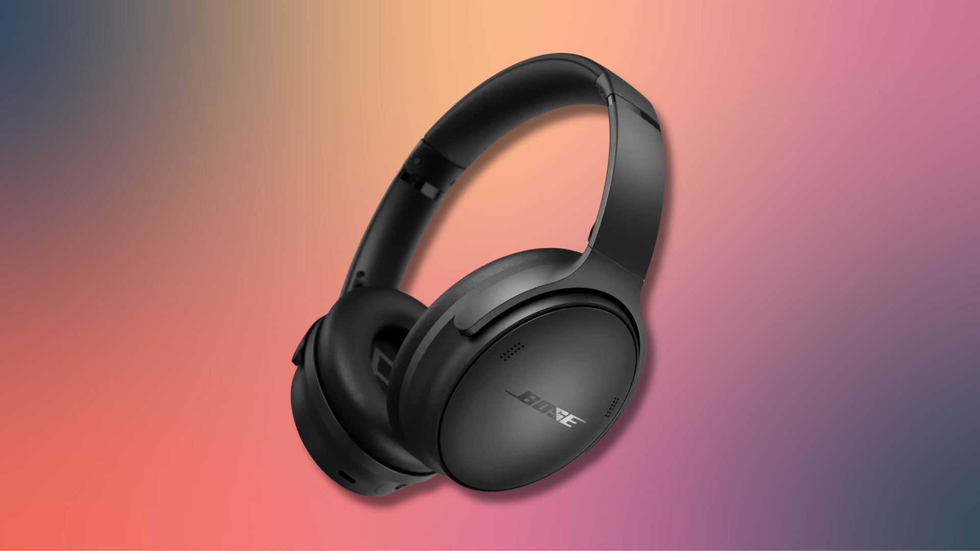 black bose quietcomfort headphones against a pink and grey gradient background