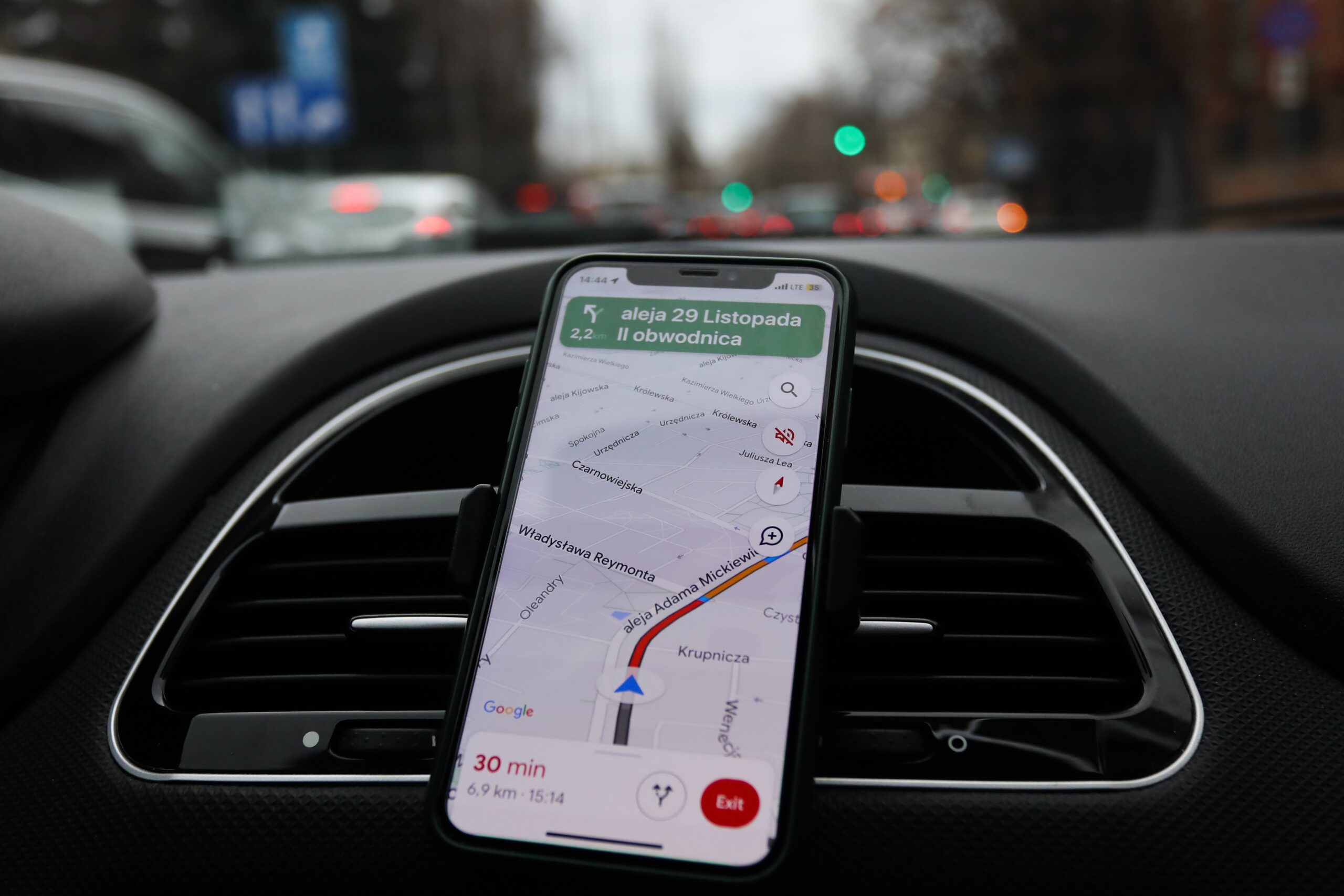 google maps on a phone attached to a dashboard