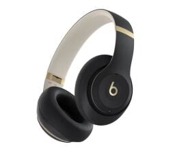 Beats Studio Pro in gold and black appear on a white background.