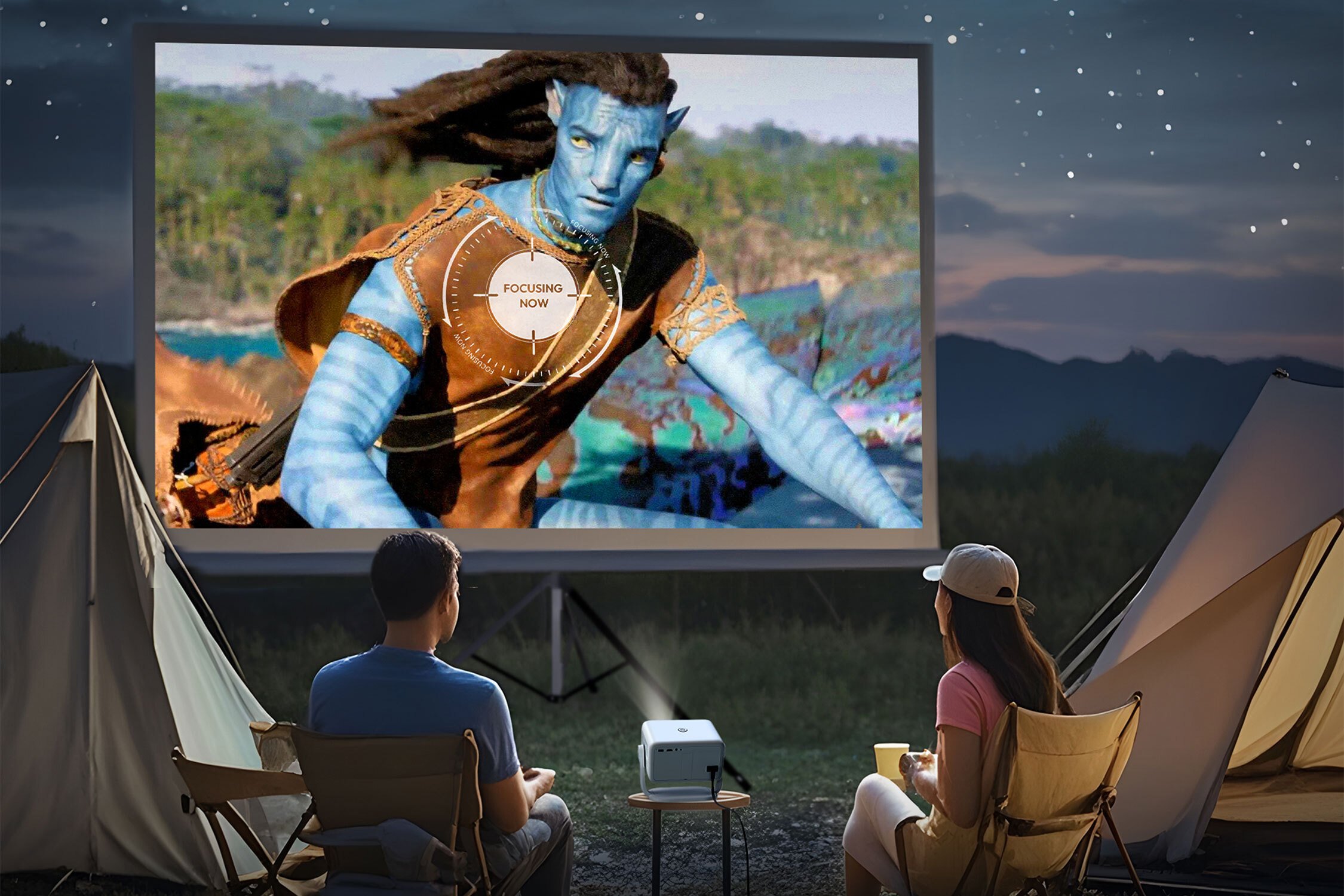 couple watching Portable Projector with avatar 2 on screen