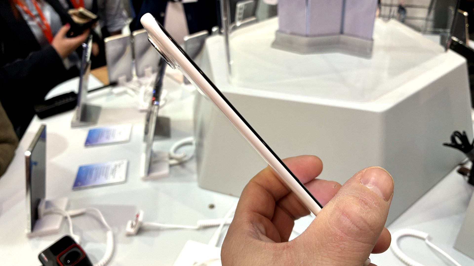 Tecno Spark Slim held in a person's hand at MWC.