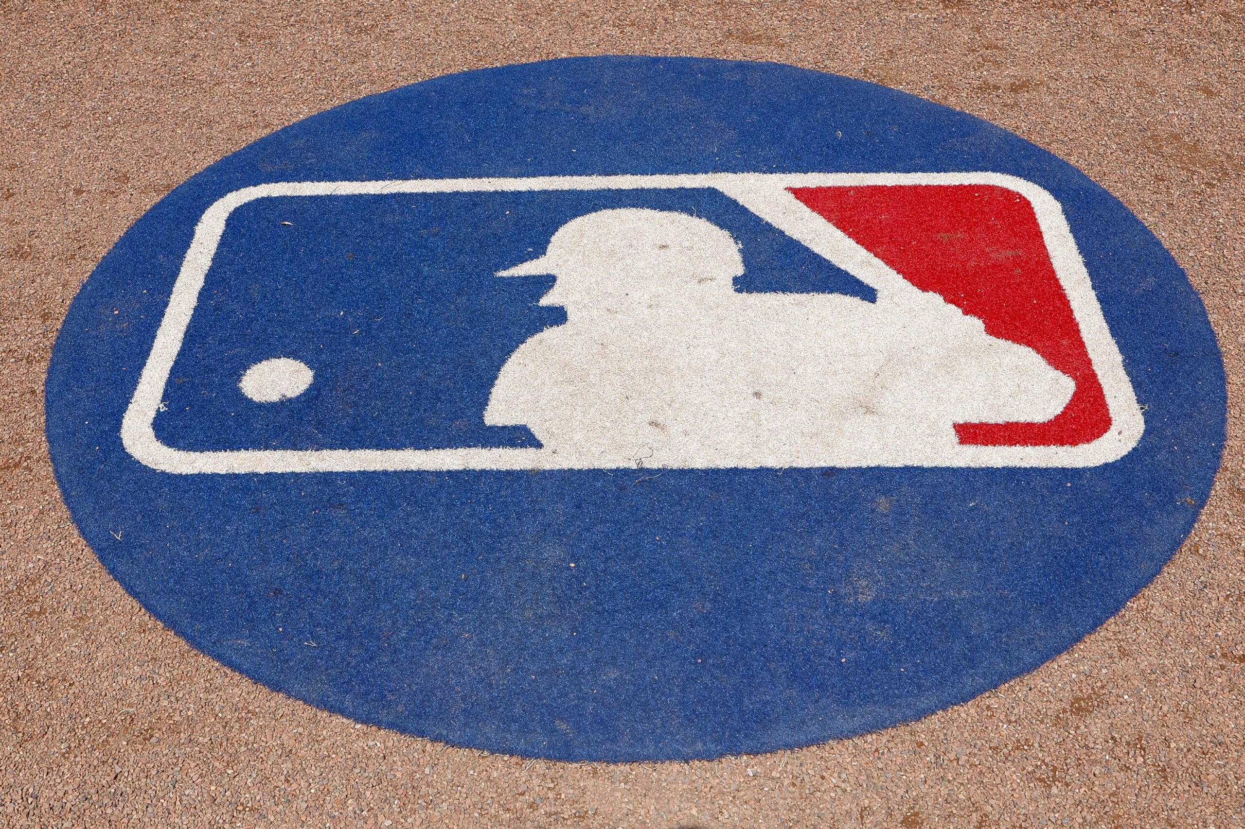 A detail view of the on deck circle with the Major League Baseball logo is seen prior to a spring training game between the Philadelphia Phillies and the Baltimore Orioles at BayCare Ballpark