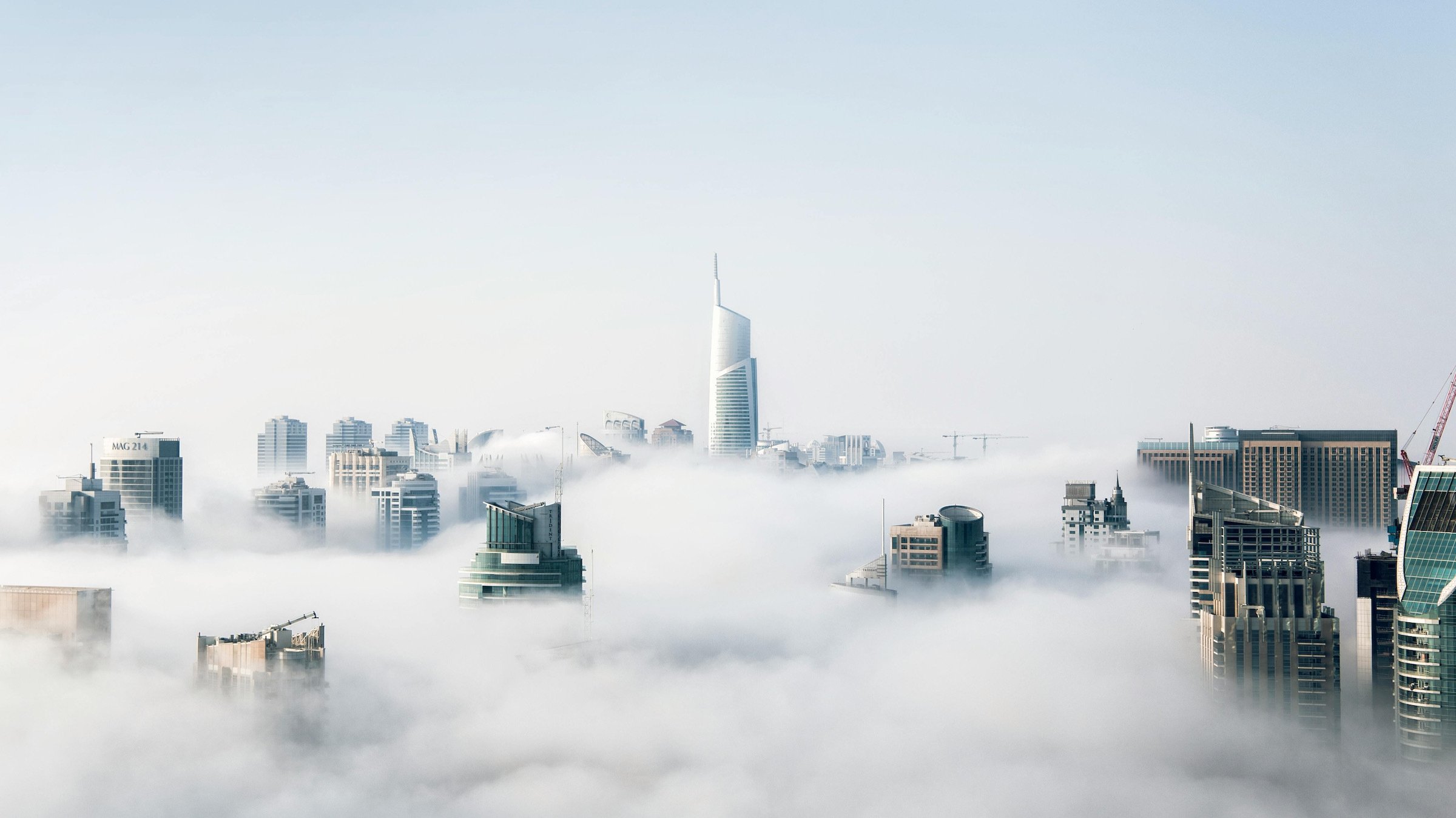 the dubai cityscape obscured by clouds