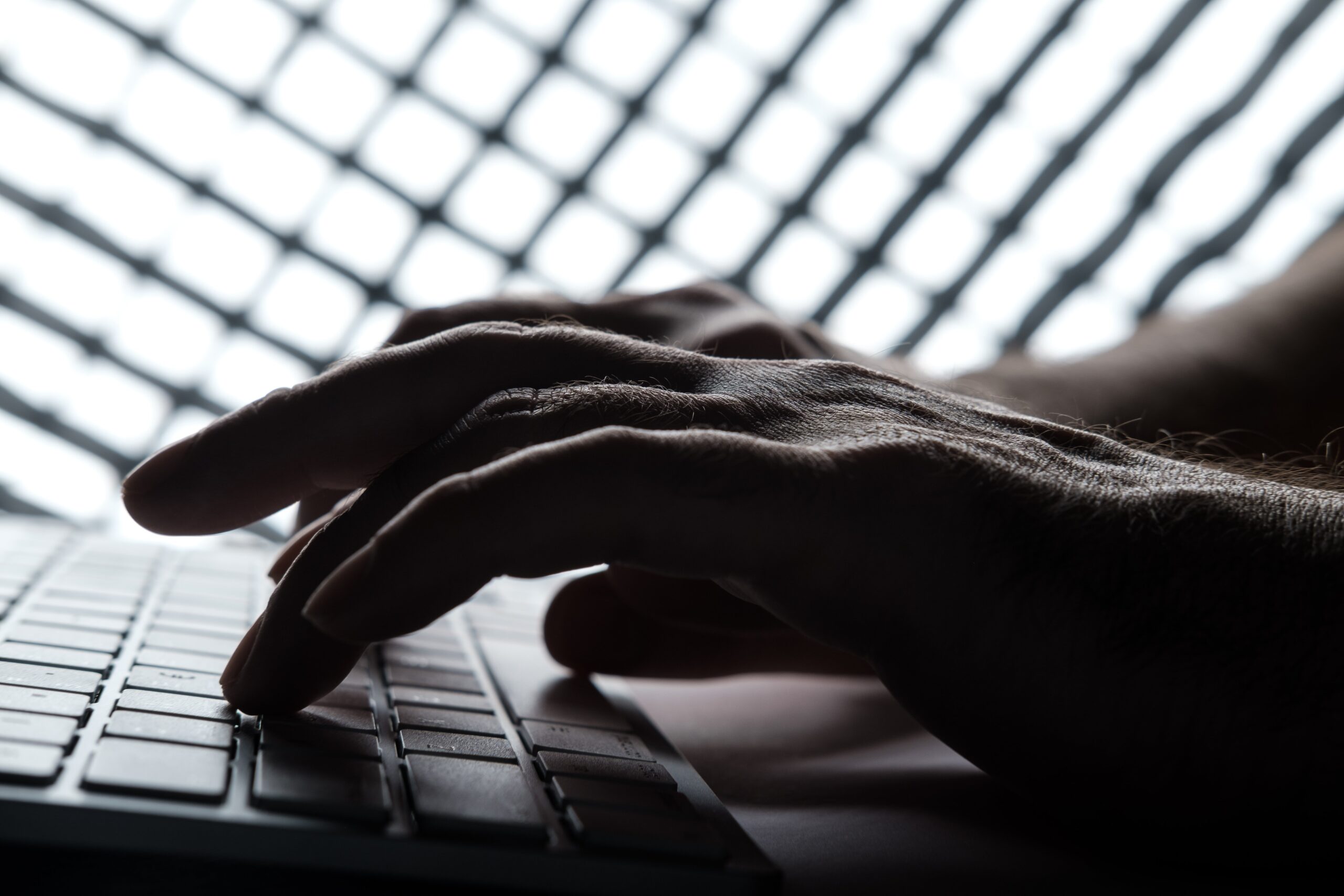 Hands typing on a keyboard