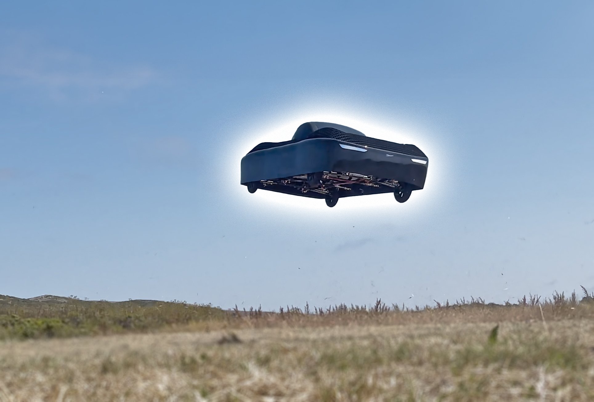 A photograph shows Alef Aeronautics' flying car hovering above a field