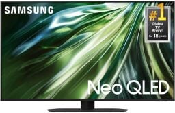 A Samsung TV screen displays a greenish abstract image and has white text on it.