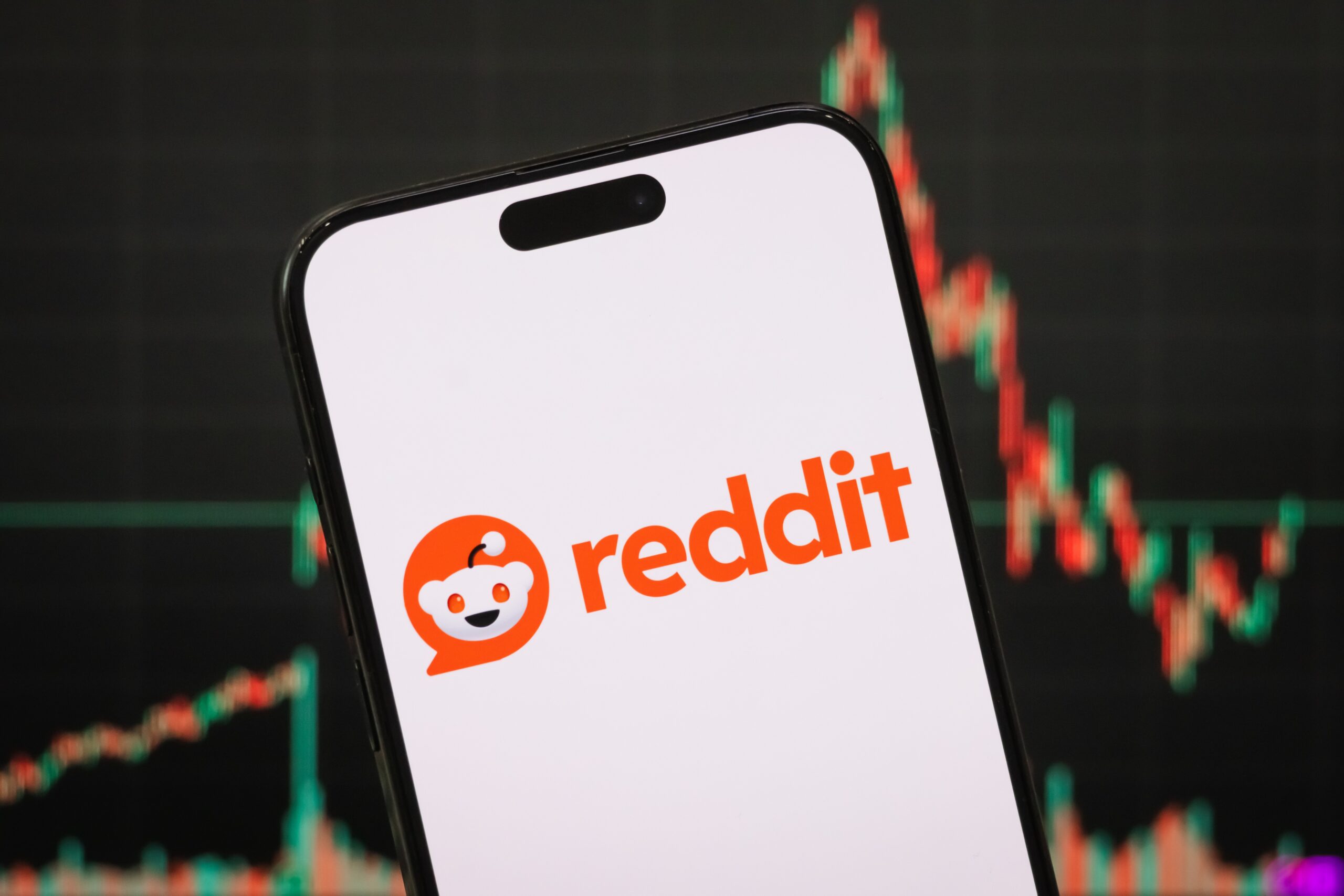 In this photo illustration, the logo of Reddit, Inc. is displayed on a smartphone screen.