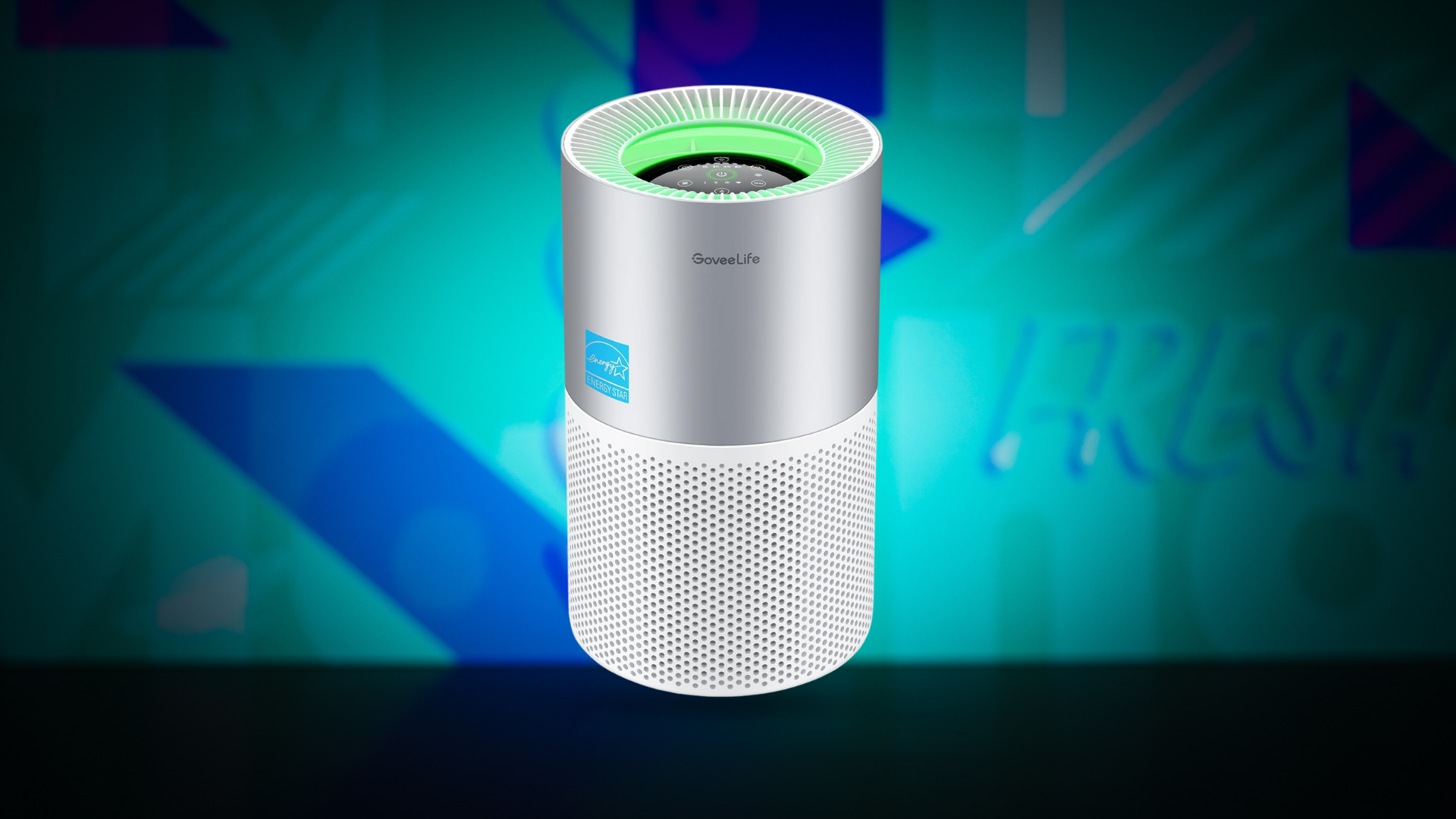 A silver and white GoveeLife smart air purifier with a green illuminated top stands centered against a vibrant teal and purple background with blurred text.