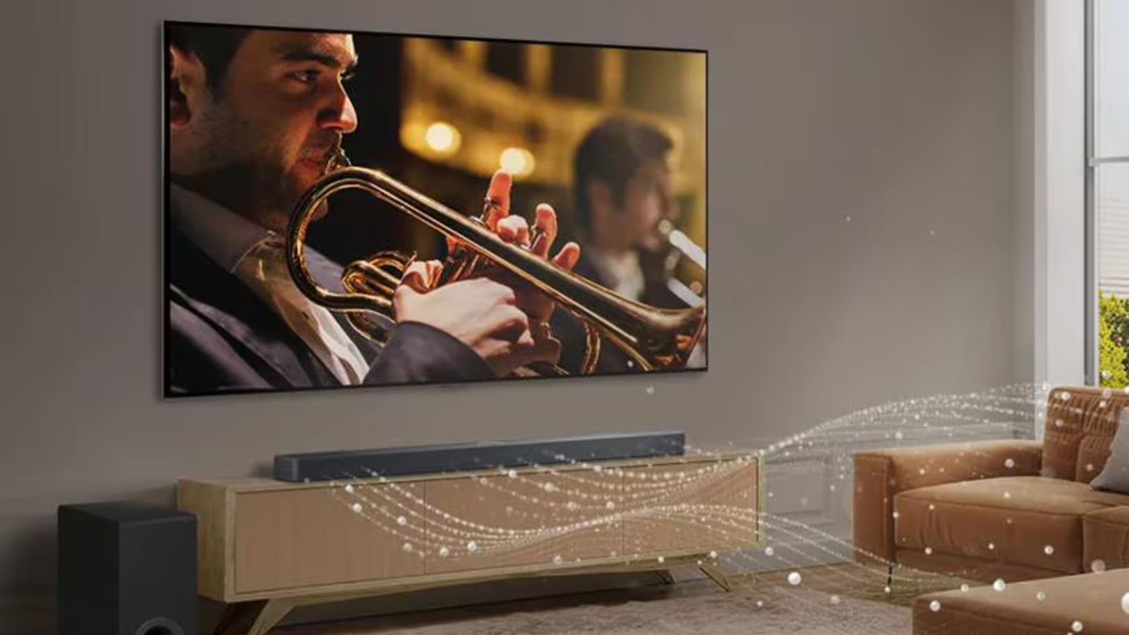 LG C4 OLED TV mounted on wall in living room with trumpet player on screen