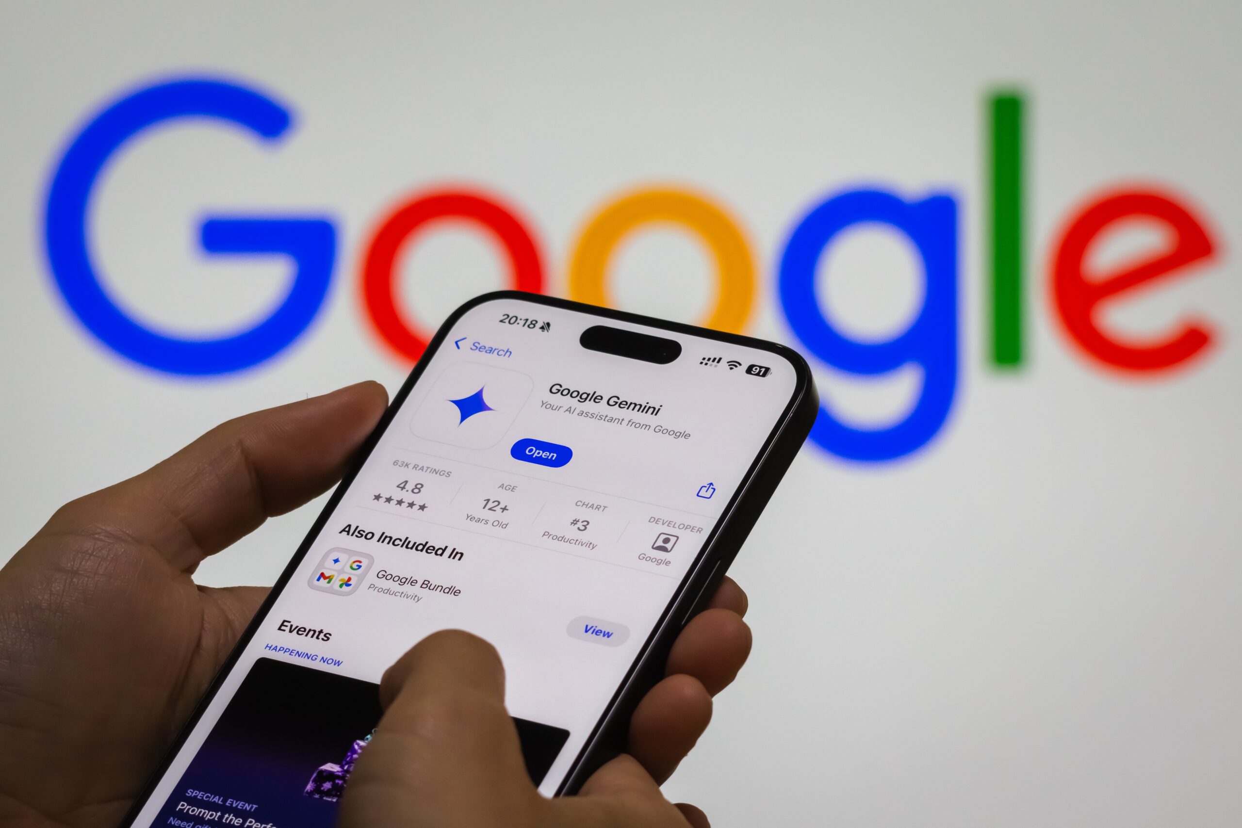  a person interacts with the “Google Gemini” app on a smartphone, with the Google logo in the background