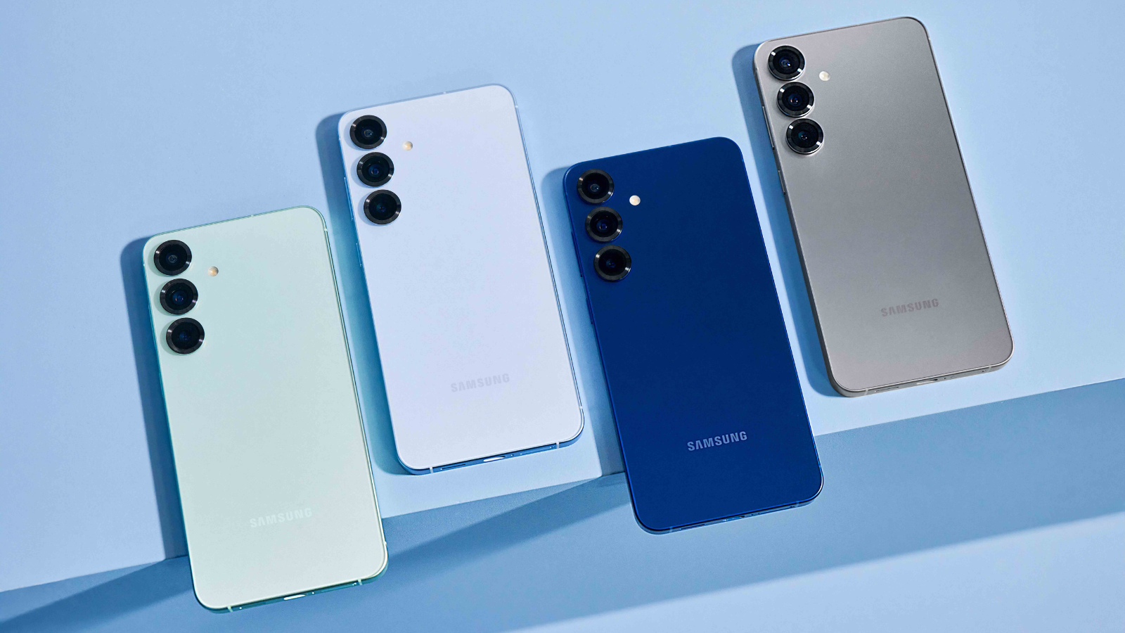 four colors of the samsung galaxy s25 lined up on a light blue surface