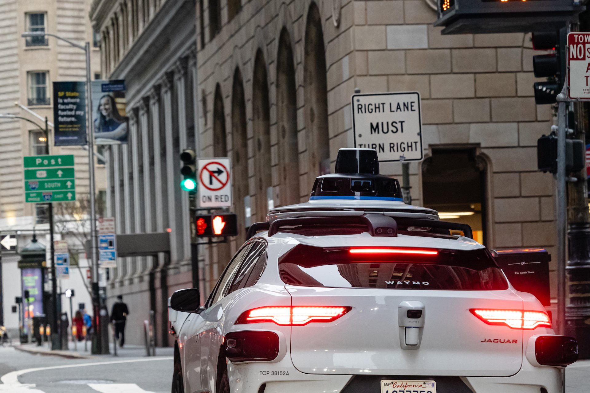 Waymo car drives in San Francisco.