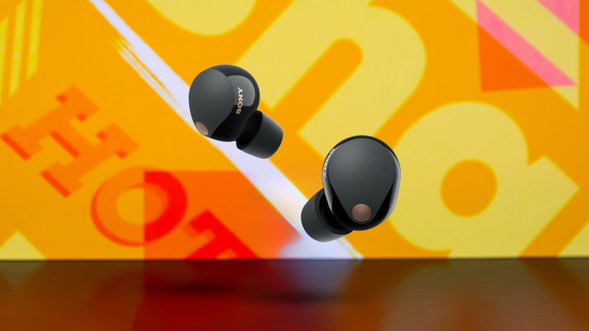 Sony WF-1000XM5 earbuds on Mashable background