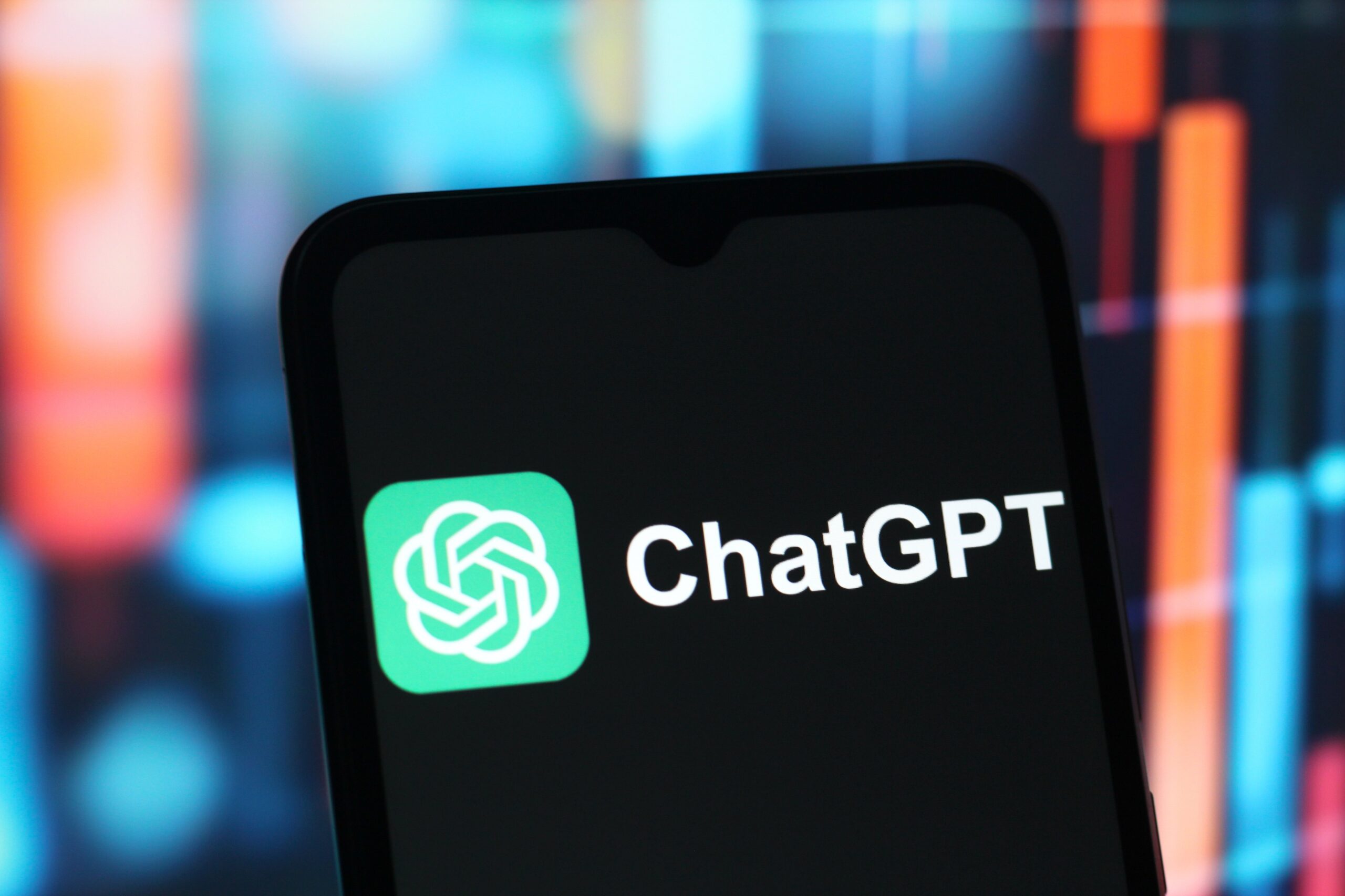The ChatGPT AI (Chat GPT) logo is seen displayed on a smartphone screen.