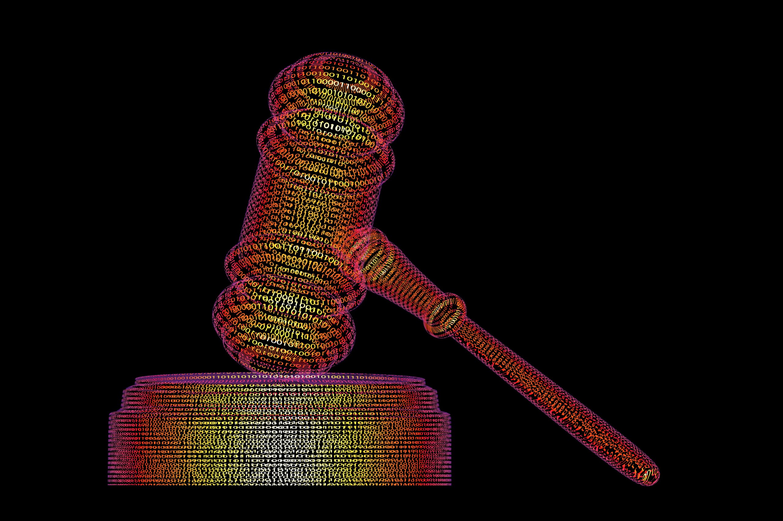 A gavel made out of multicolored lines of code on a black background.