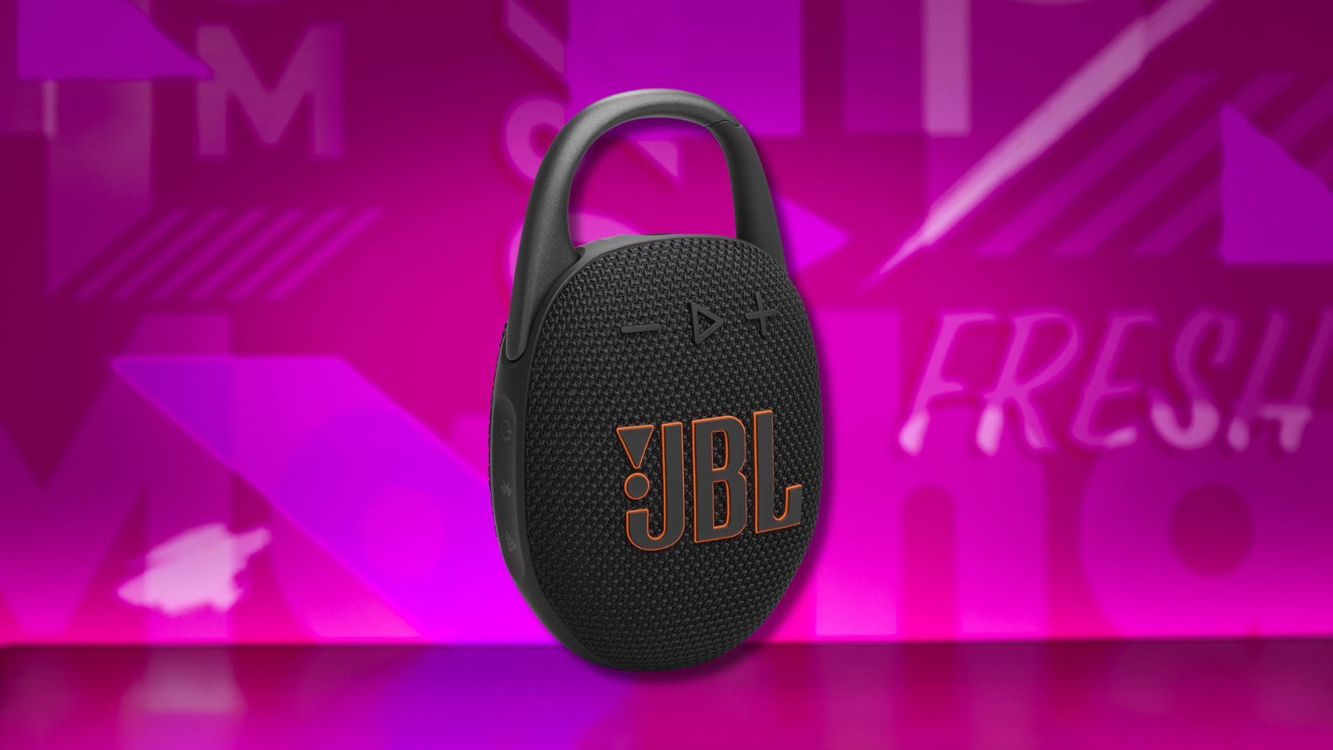 jbl clip 5 portable speaker against a pink patterned background
