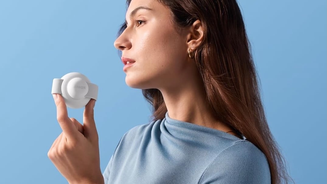 woman holding anker UFO 3-in-1 wireless charging station