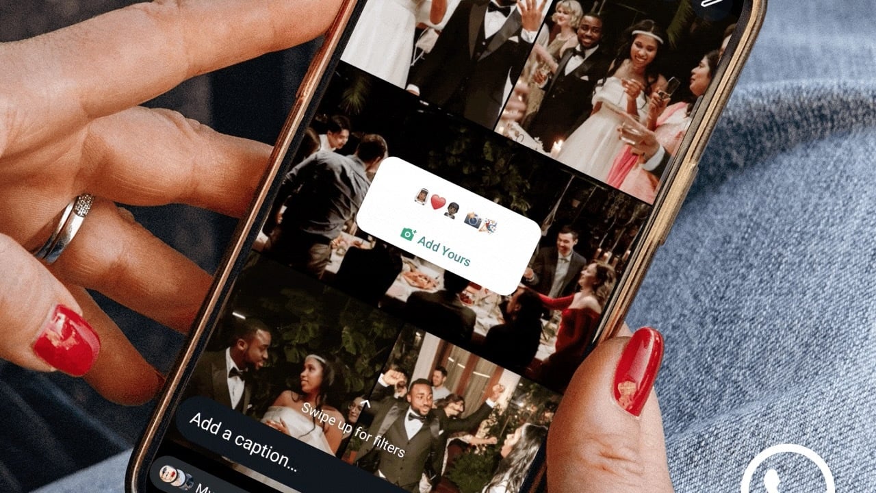 close-up of woman holding phone and using whatsapp status feature