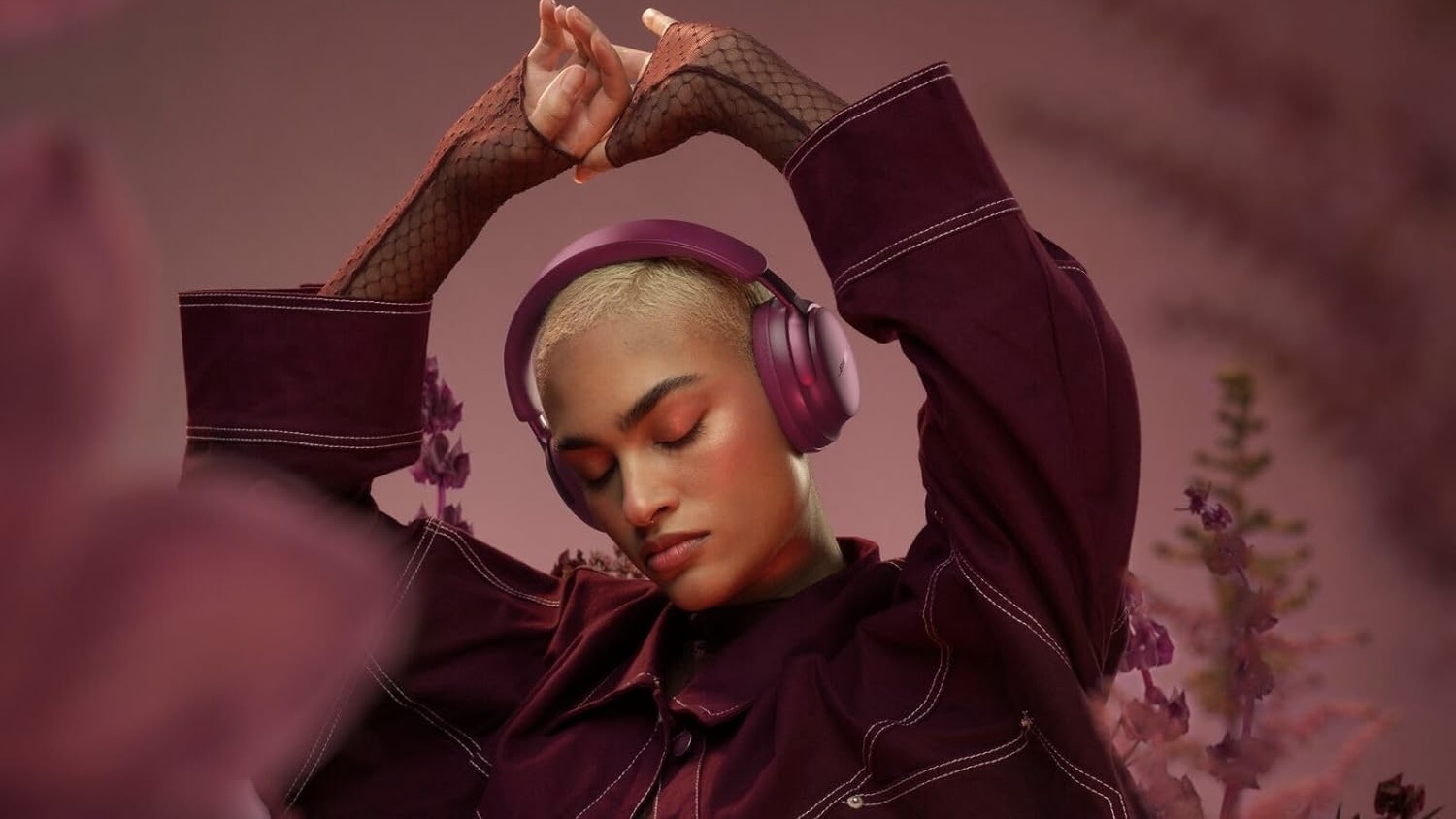 person in plum landscape wearing bose plum headphones 