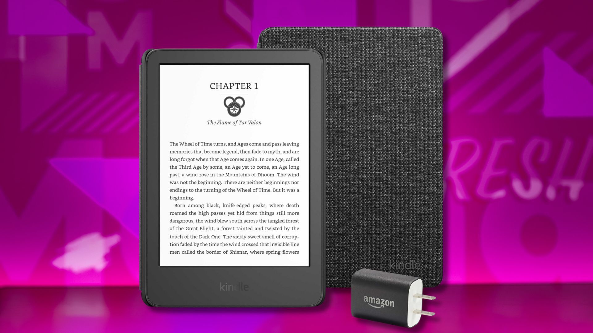kindle, kindle cover, and power adapter against a pink patterned background