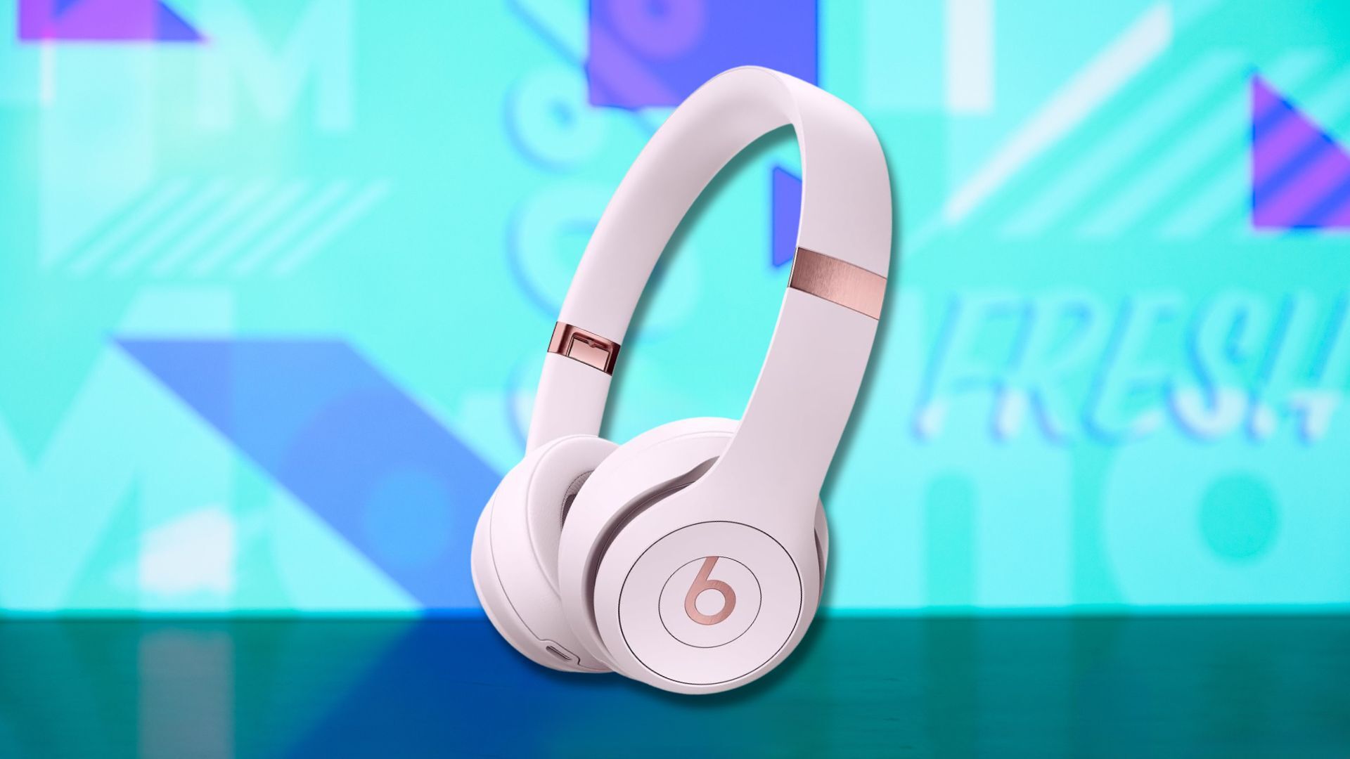 beats solo 4 headphones against a light blue patterned background